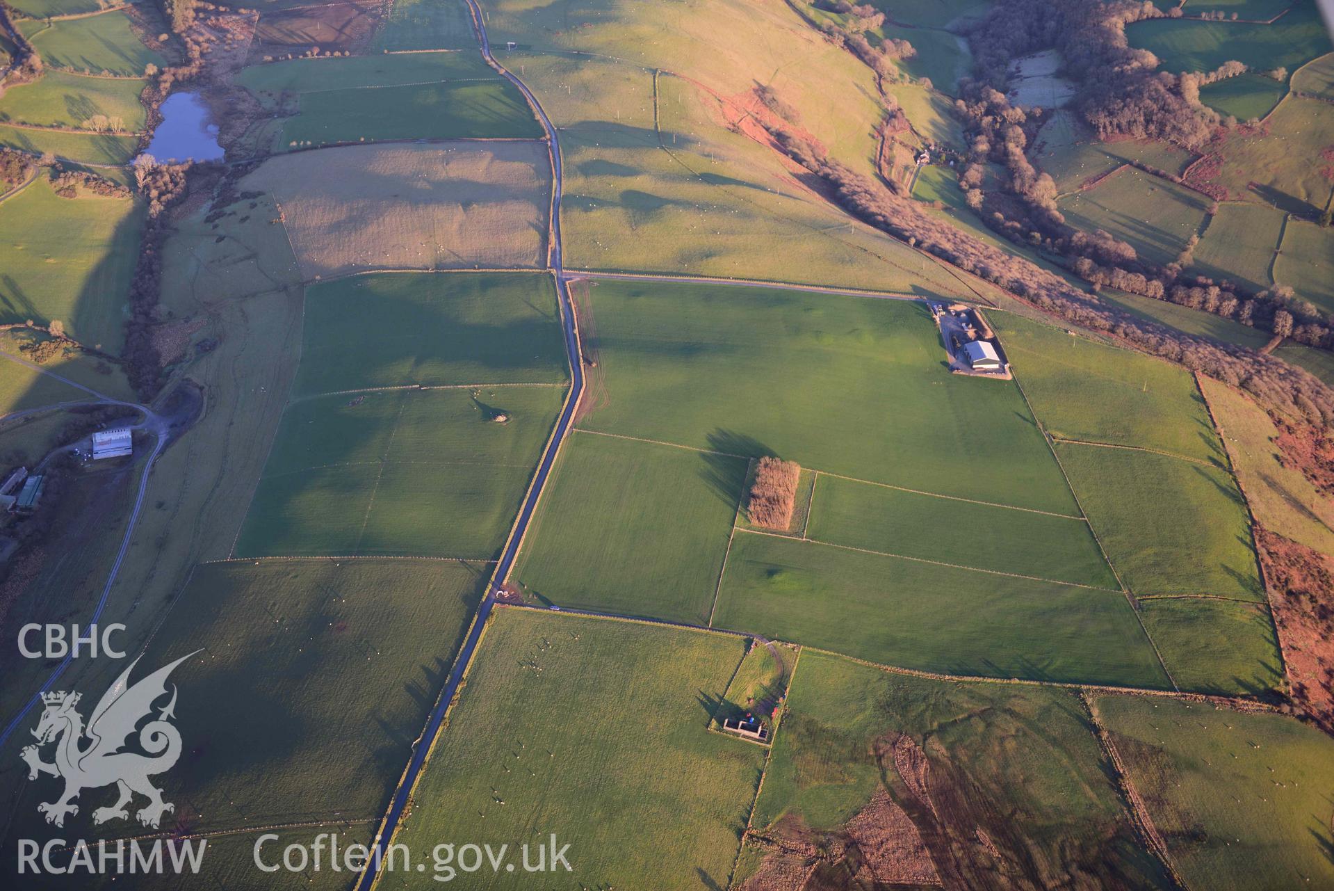 Oblique aerial photograph of Banc Troed Rhiw Seiri round barrow and other barrow earthworks. Taken during the Royal Commission’s programme of archaeological aerial reconnaissance by Toby Driver on 17th January 2022