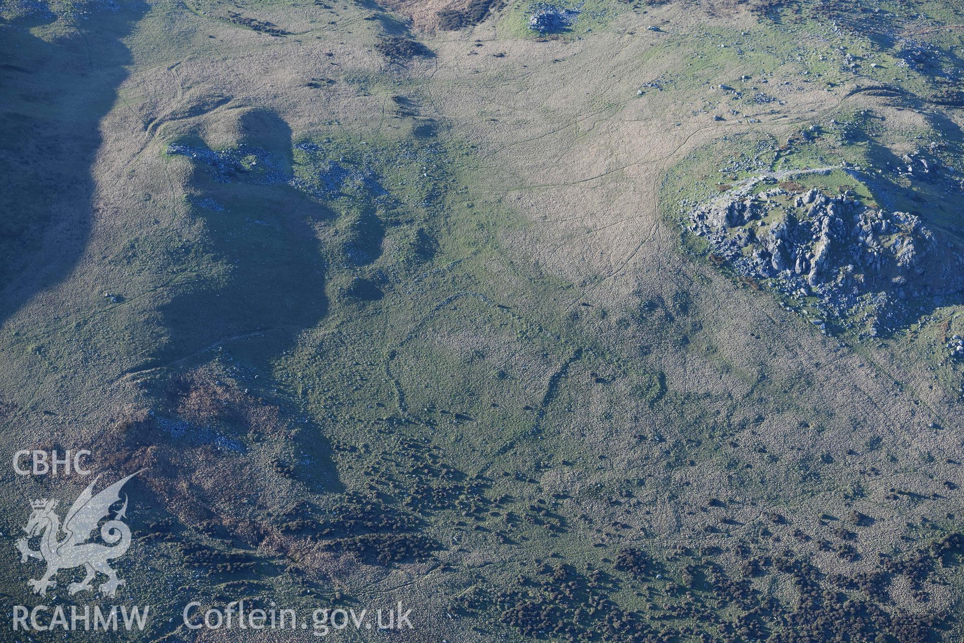 Oblique aerial photograph of field systems to the south of Carn Alw taken during the Royal Commission’s programme of archaeological aerial reconnaissance by Toby Driver on 17th January 2022