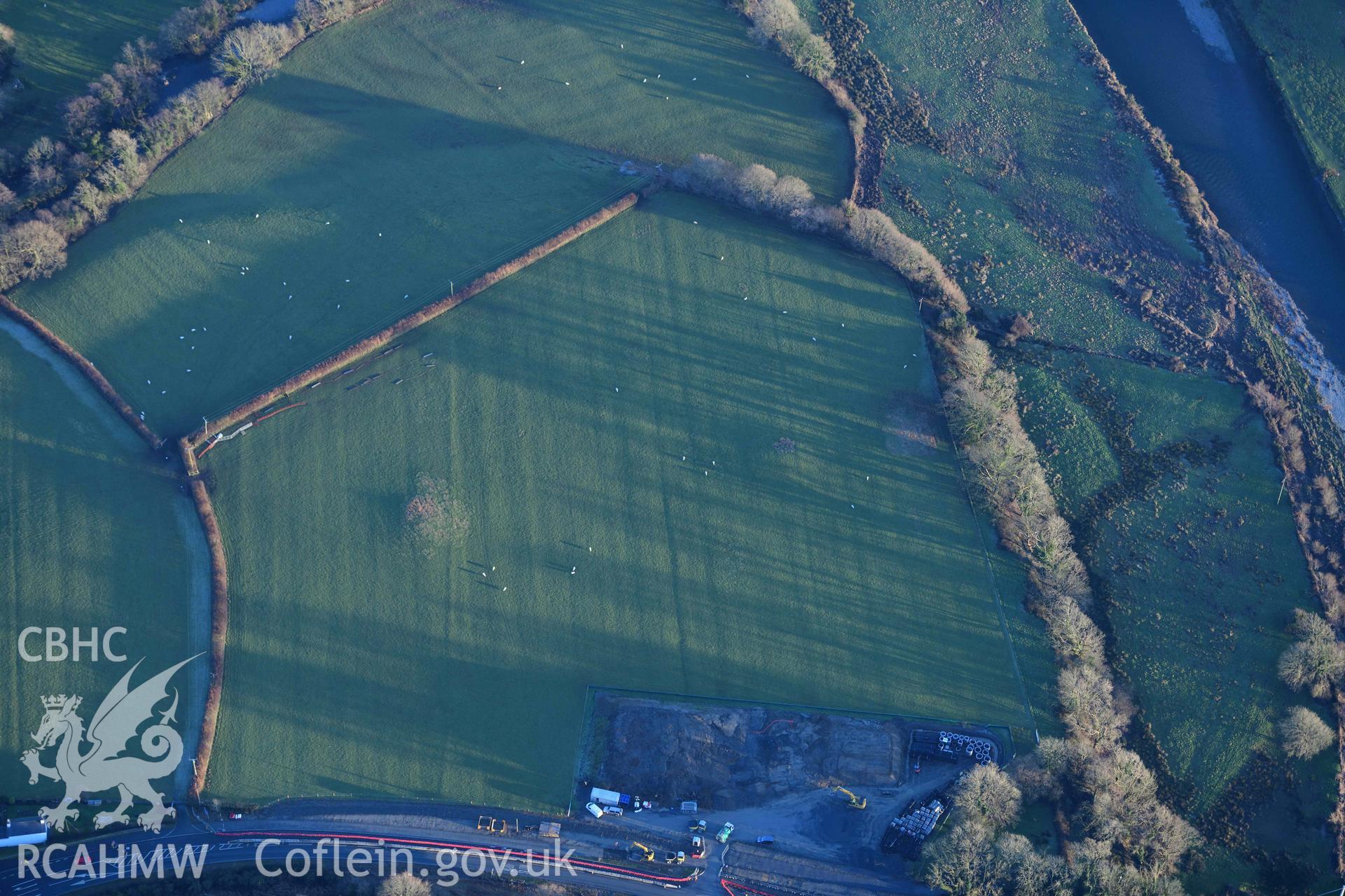 Oblique aerial photograph showing view of Ffridd round barrows from the north west. Taken during the Royal Commission’s programme of archaeological aerial reconnaissance by Toby Driver on 17th January 2022