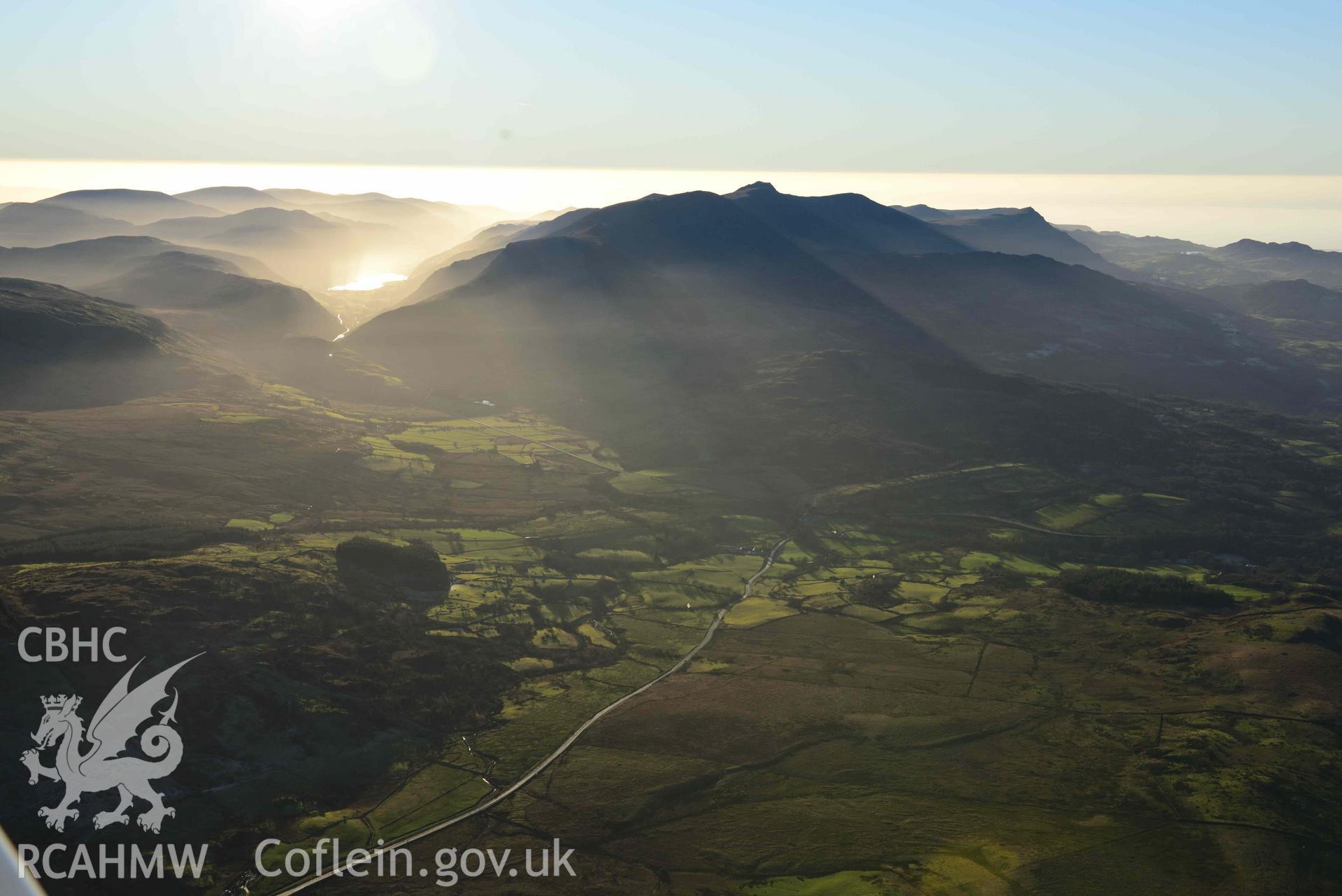 Oblique aerial photograph of Cader Idris winter landscape from the north east, looking over Brithdir. Taken during the Royal Commission’s programme of archaeological aerial reconnaissance by Toby Driver on 17th January 2022