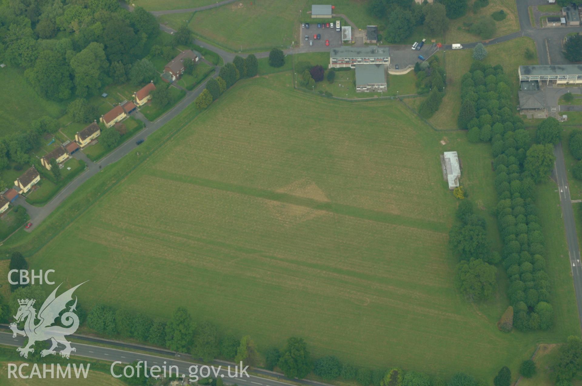 RCAHMW colour oblique aerial photograph of cropmark at Cwrt-y-Gollen Garden, Llangenny. Taken on 26 May 2004 by Toby Driver