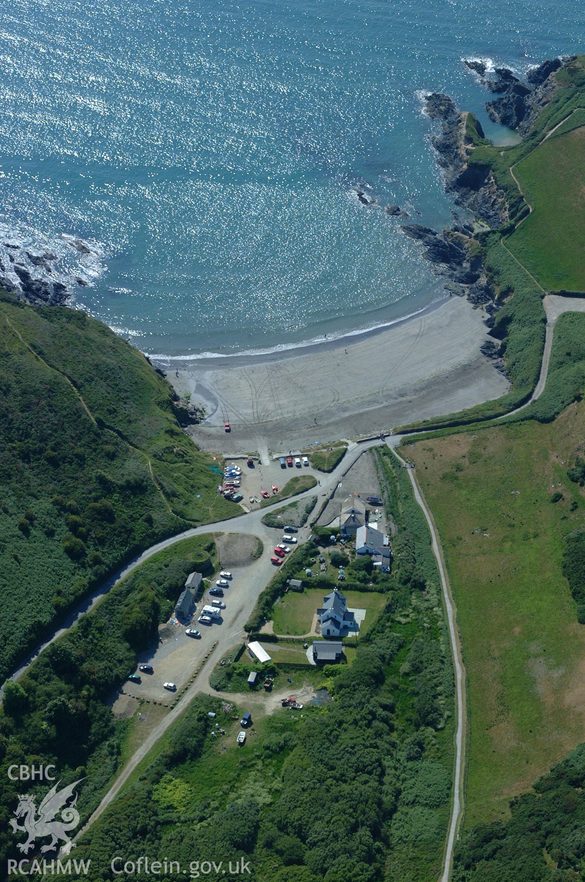 RCAHMW colour oblique aerial photograph of Pwll Gwaelod landscape with Pen Castell at the top-right of the frame. Taken on 15 June 2004 by Toby Driver