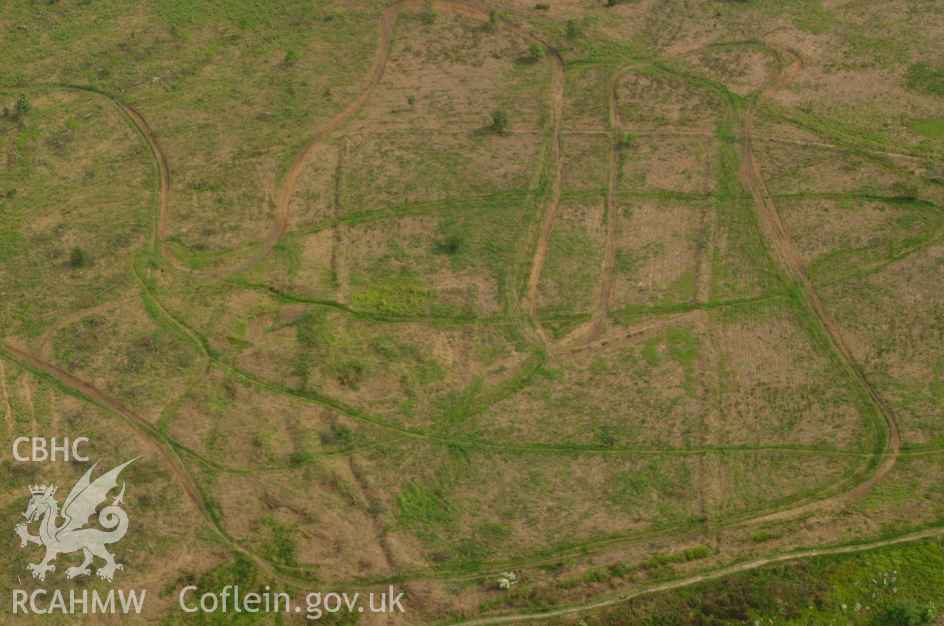 RCAHMW colour oblique aerial photograph of Grey Hill Field System. Taken on 26 May 2004 by Toby Driver