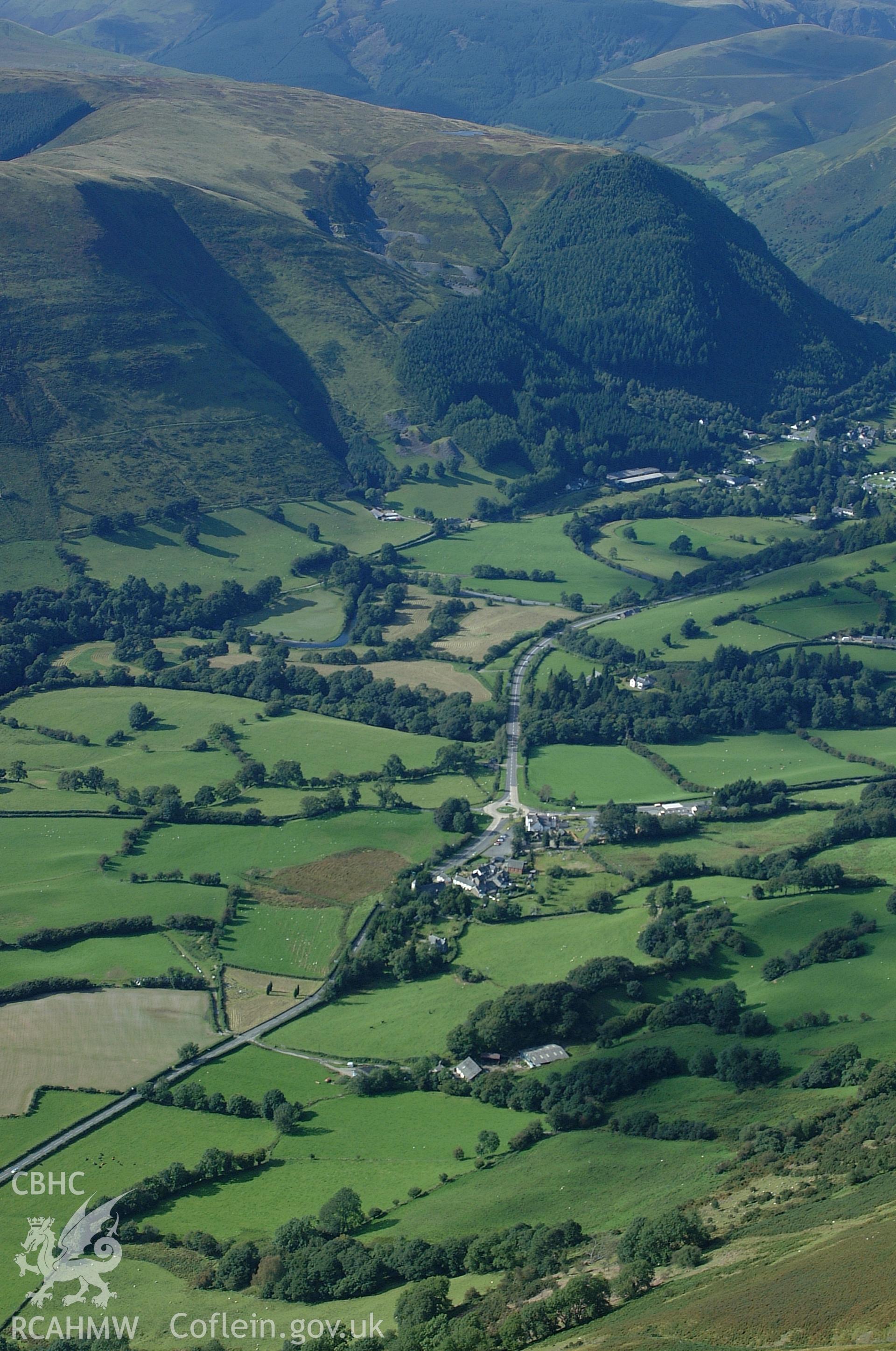 RCAHMW colour oblique aerial photograph of Mallwyd Village, high view from the south-east. Taken on 31 August 2004 by Toby Driver