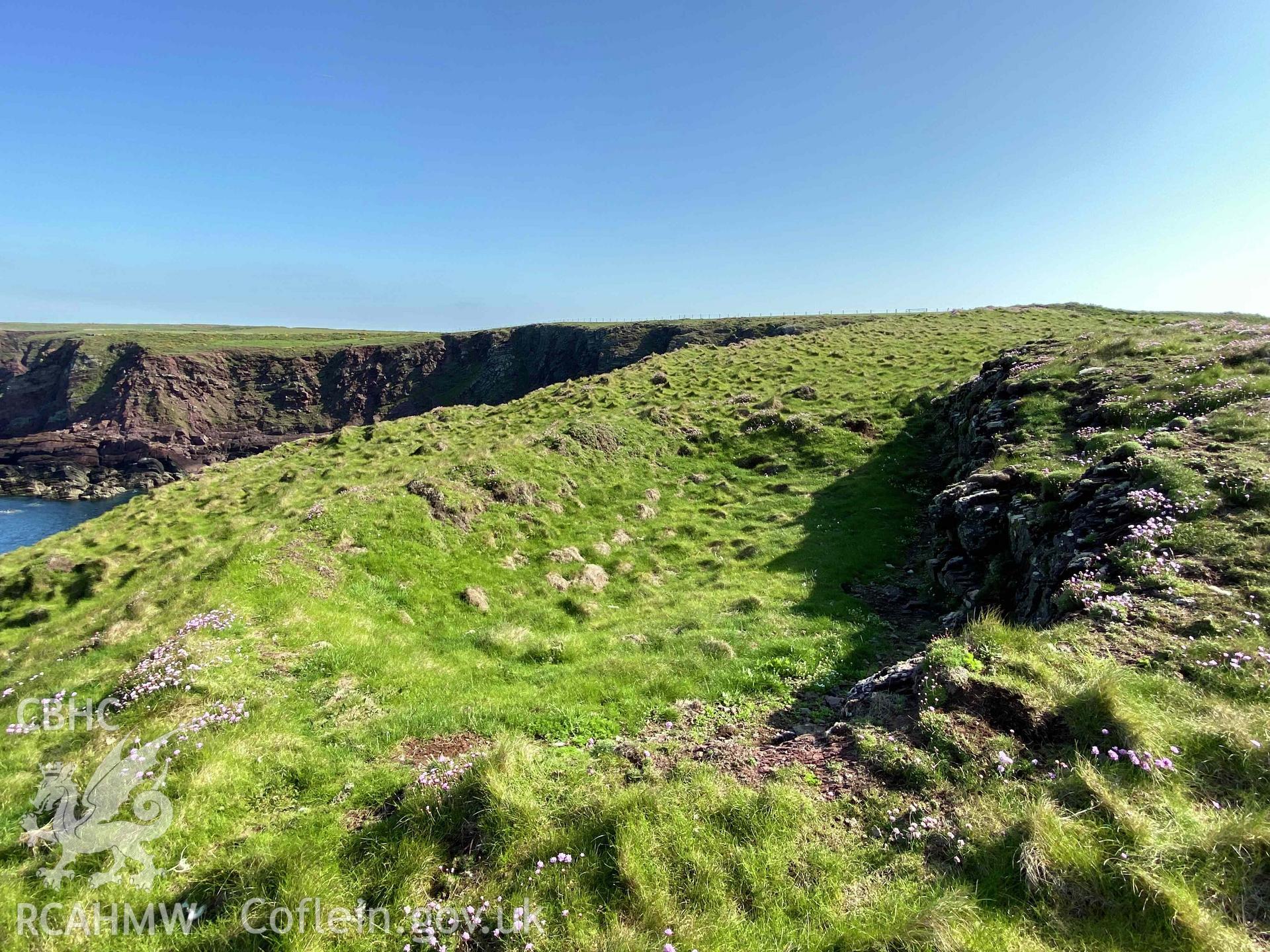 Digital photograph showing rock-cut hut sites at Sheep Island, produced by Paul Davis in 2023