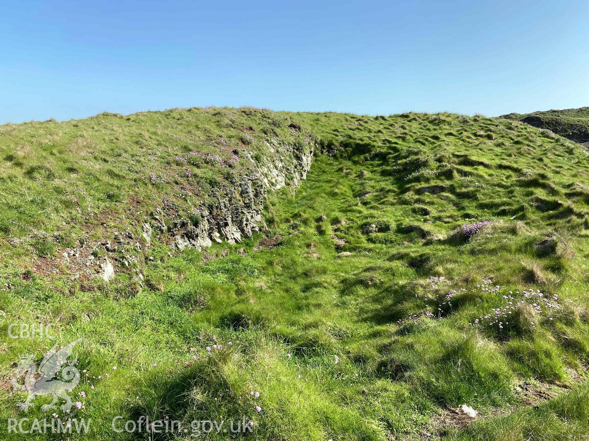 Digital photograph showing rock-cut hut sites at Sheep Island, produced by Paul Davis in 2023