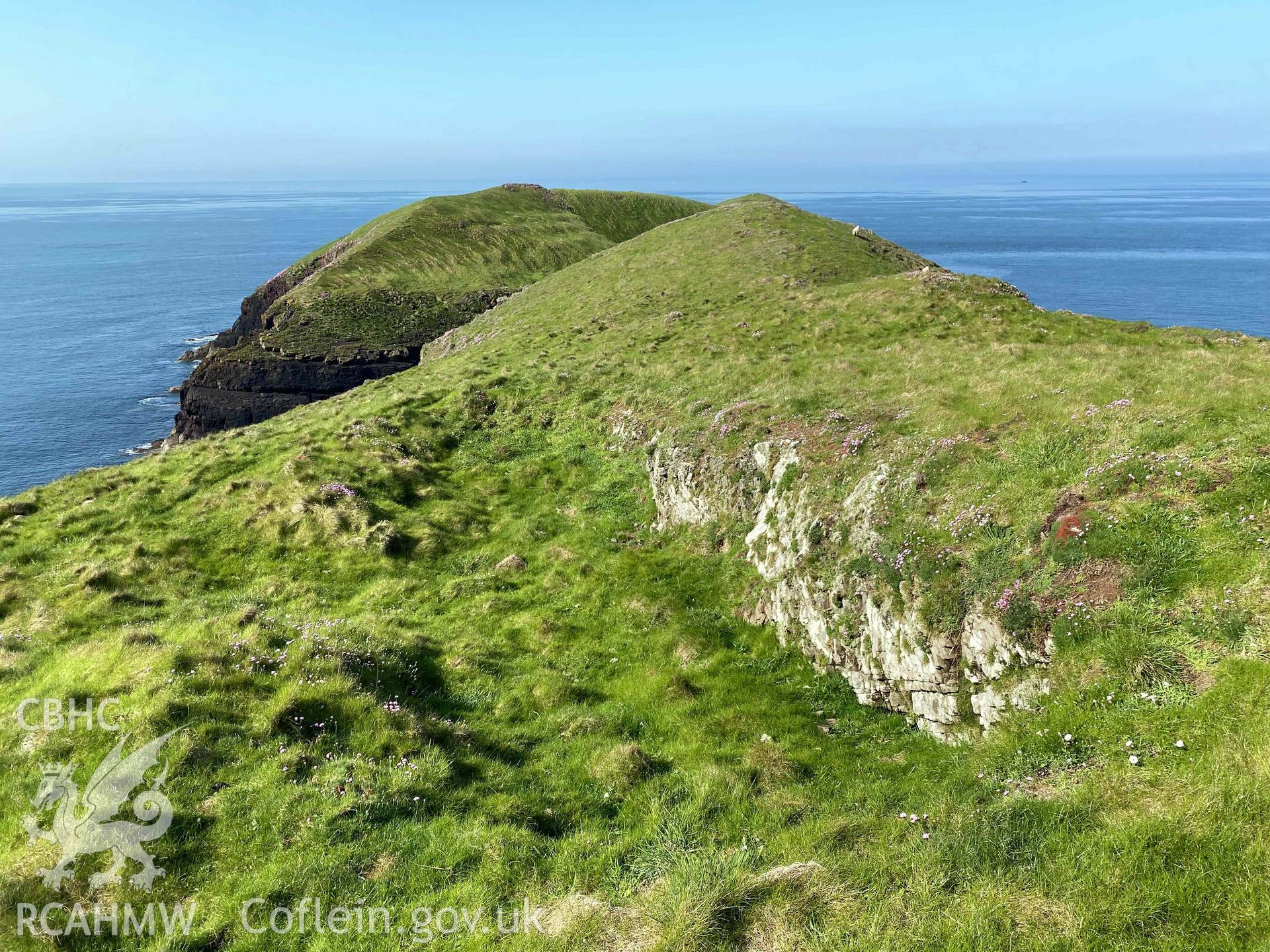 Digital photograph showing rock-cut hut sites at Sheep Island, produced by Paul Davis in 2023