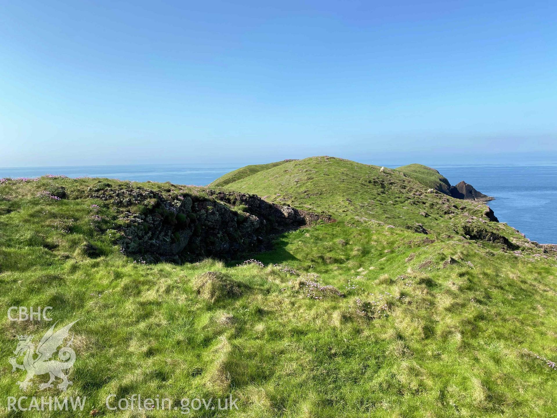 Digital photograph showing rock-cut hut sites at Sheep Island, produced by Paul Davis in 2023