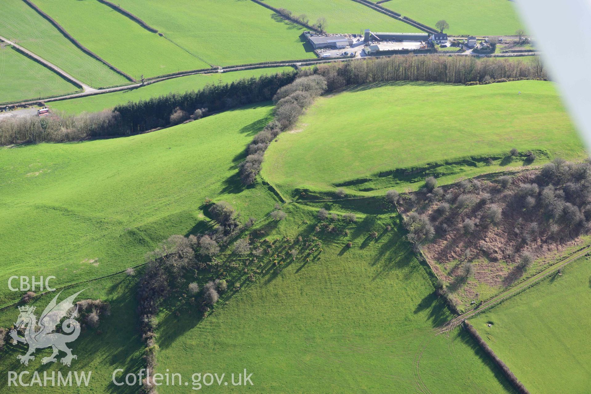 Merlin's Hill hillfort, wide view from the east. Oblique aerial photograph taken during the Royal Commission’s programme of archaeological aerial reconnaissance by Toby Driver on 14 March 2022.