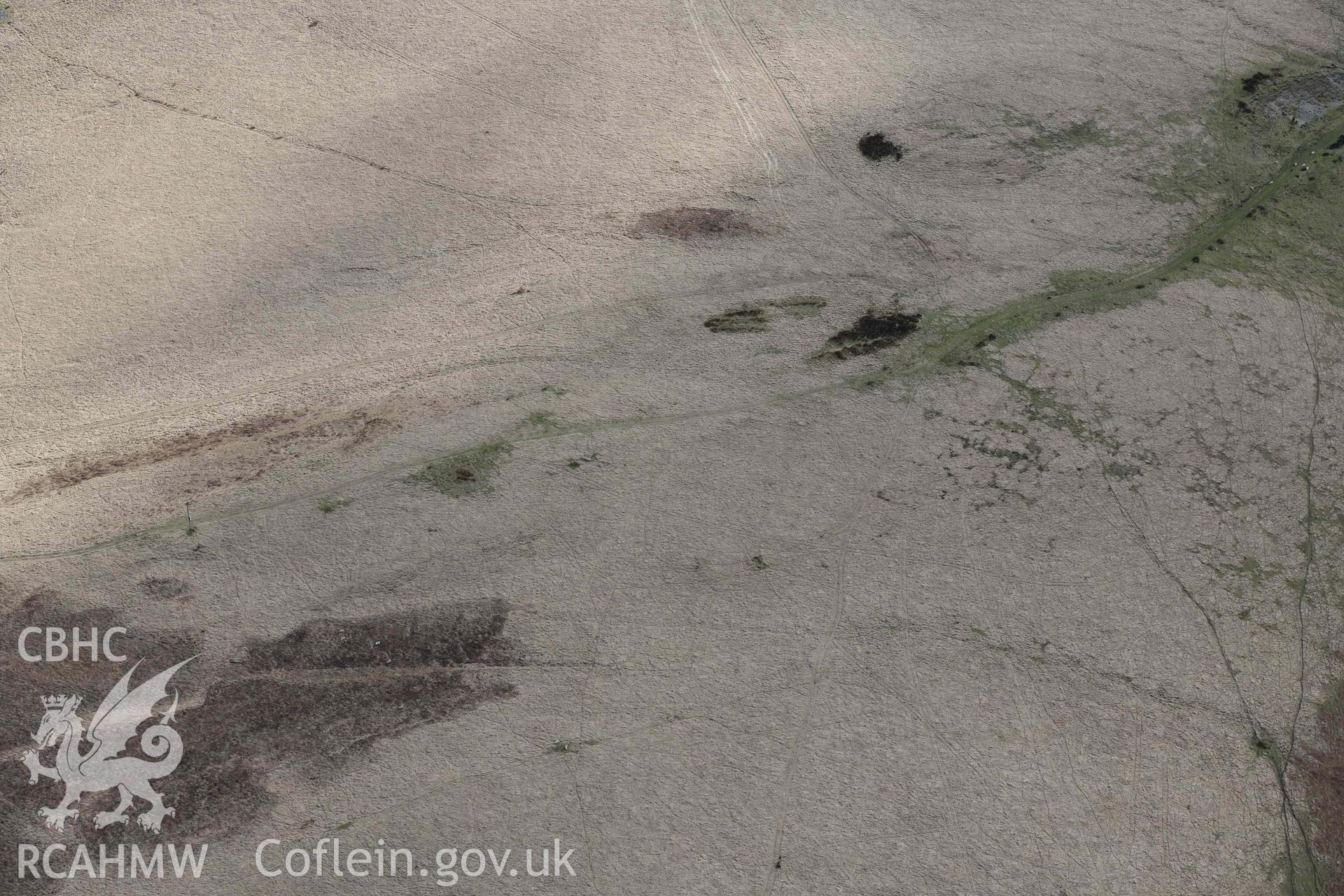 Ring cairn on Esgair Ceiliog. Oblique aerial photograph taken during the Royal Commission’s programme of archaeological aerial reconnaissance by Toby Driver on 14 March 2022.