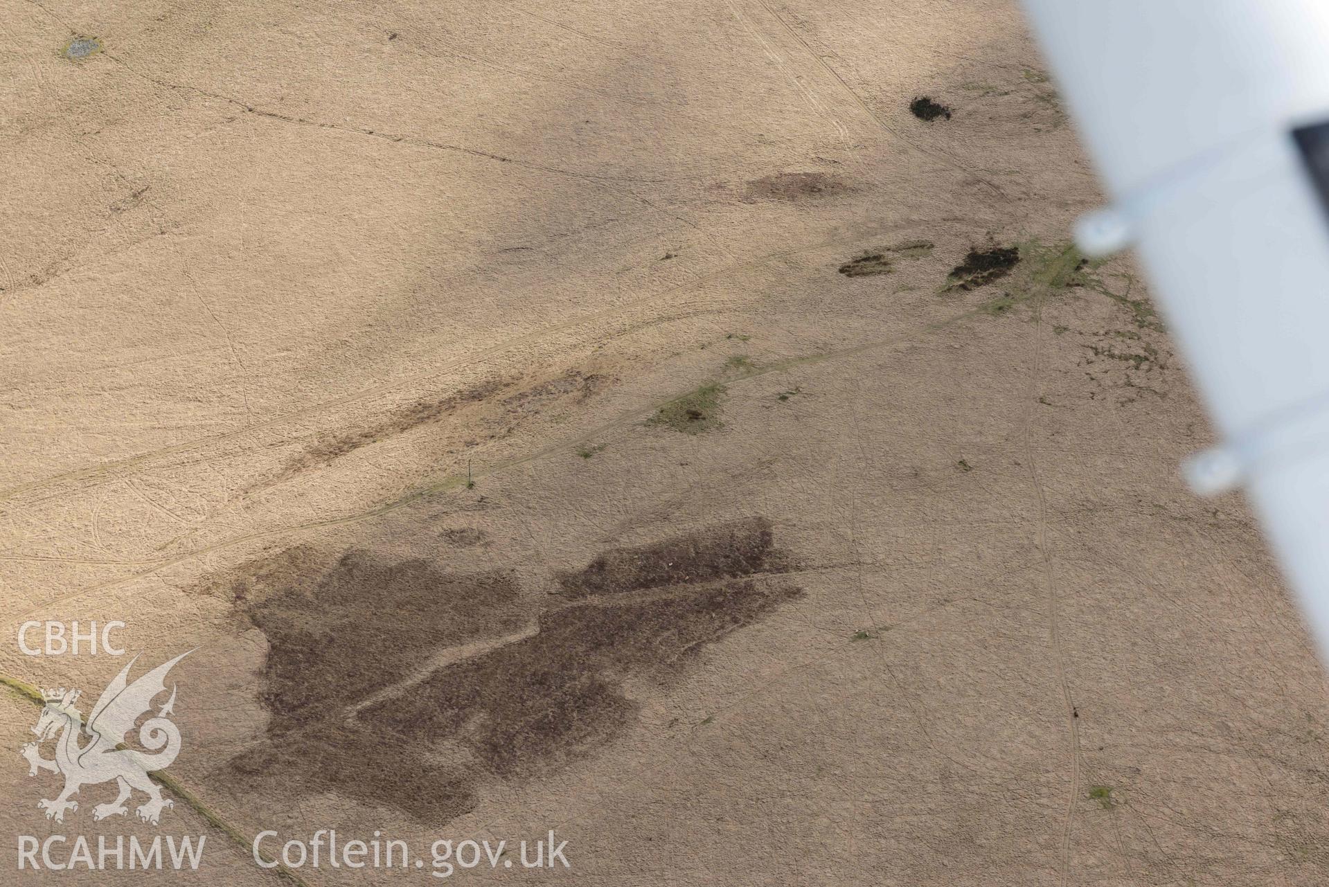 Ring cairn on Esgair Ceiliog. Oblique aerial photograph taken during the Royal Commission’s programme of archaeological aerial reconnaissance by Toby Driver on 14 March 2022.