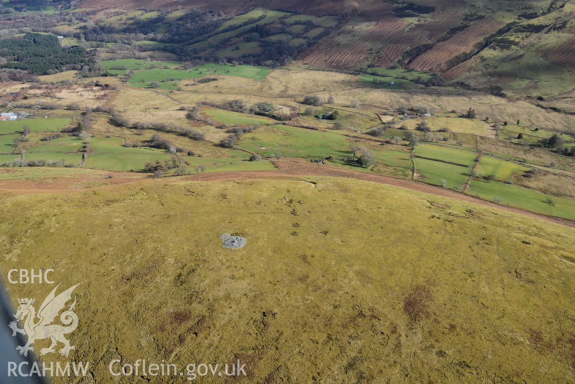 Y Gamriw or Graig Ddu, eastern cairn. Oblique aerial photograph taken during the Royal Commission’s programme of archaeological aerial reconnaissance by Toby Driver on 14 March 2022.