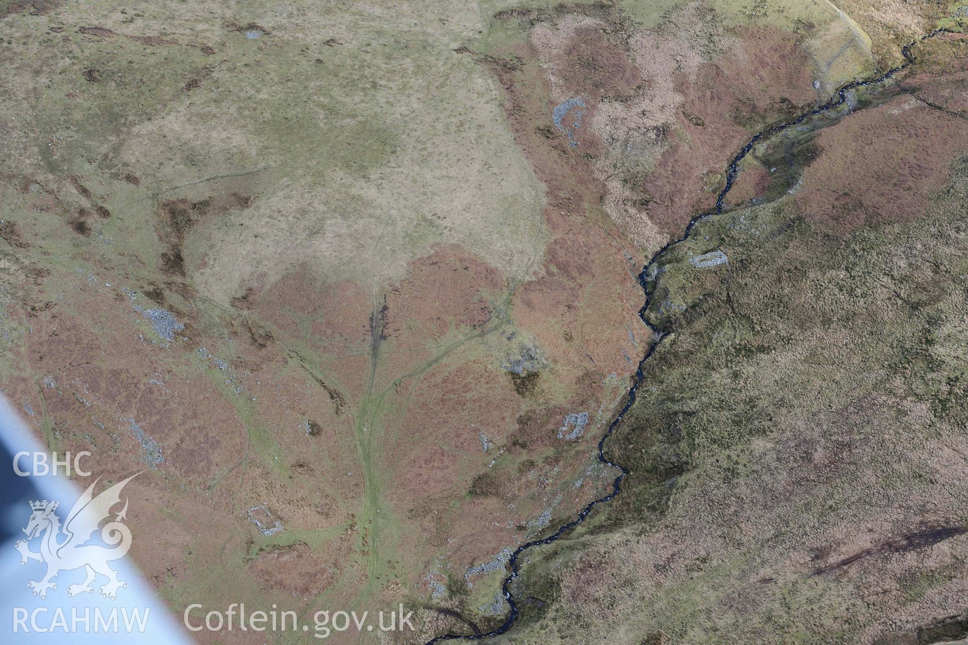 Esgair Gwar y Cae hafotau settlement, Nant Rhyd Goch. Oblique aerial photograph taken during the Royal Commission’s programme of archaeological aerial reconnaissance by Toby Driver on 14 March 2022.