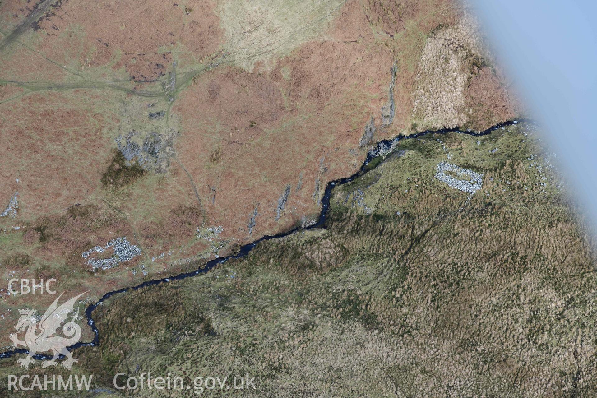 Esgair Gwar y Cae hafotau settlement, Nant Rhyd Goch. Oblique aerial photograph taken during the Royal Commission’s programme of archaeological aerial reconnaissance by Toby Driver on 14 March 2022.