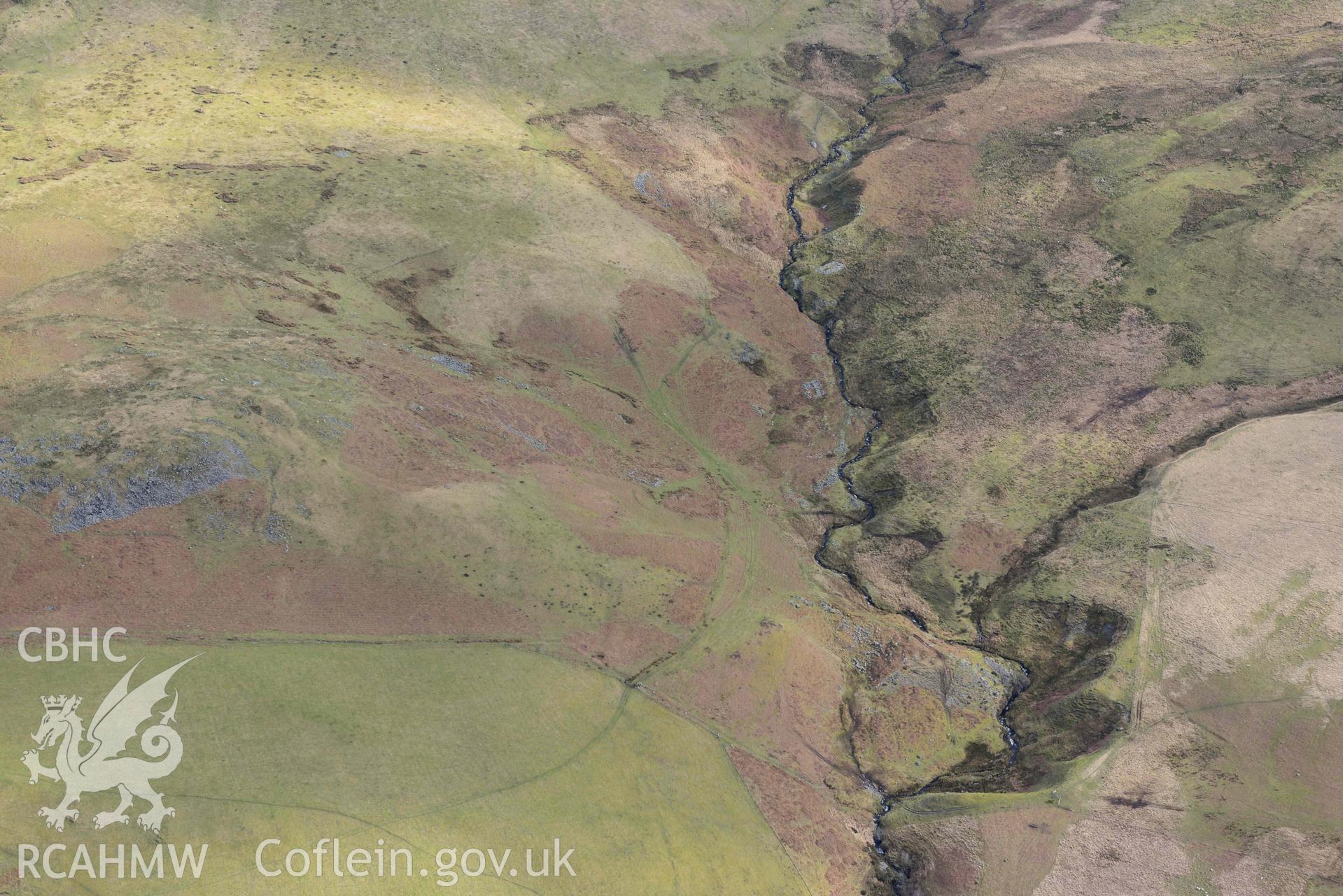 Esgair Gwar y Cae hafotau settlement, Nant Rhyd Goch. Oblique aerial photograph taken during the Royal Commission’s programme of archaeological aerial reconnaissance by Toby Driver on 14 March 2022.