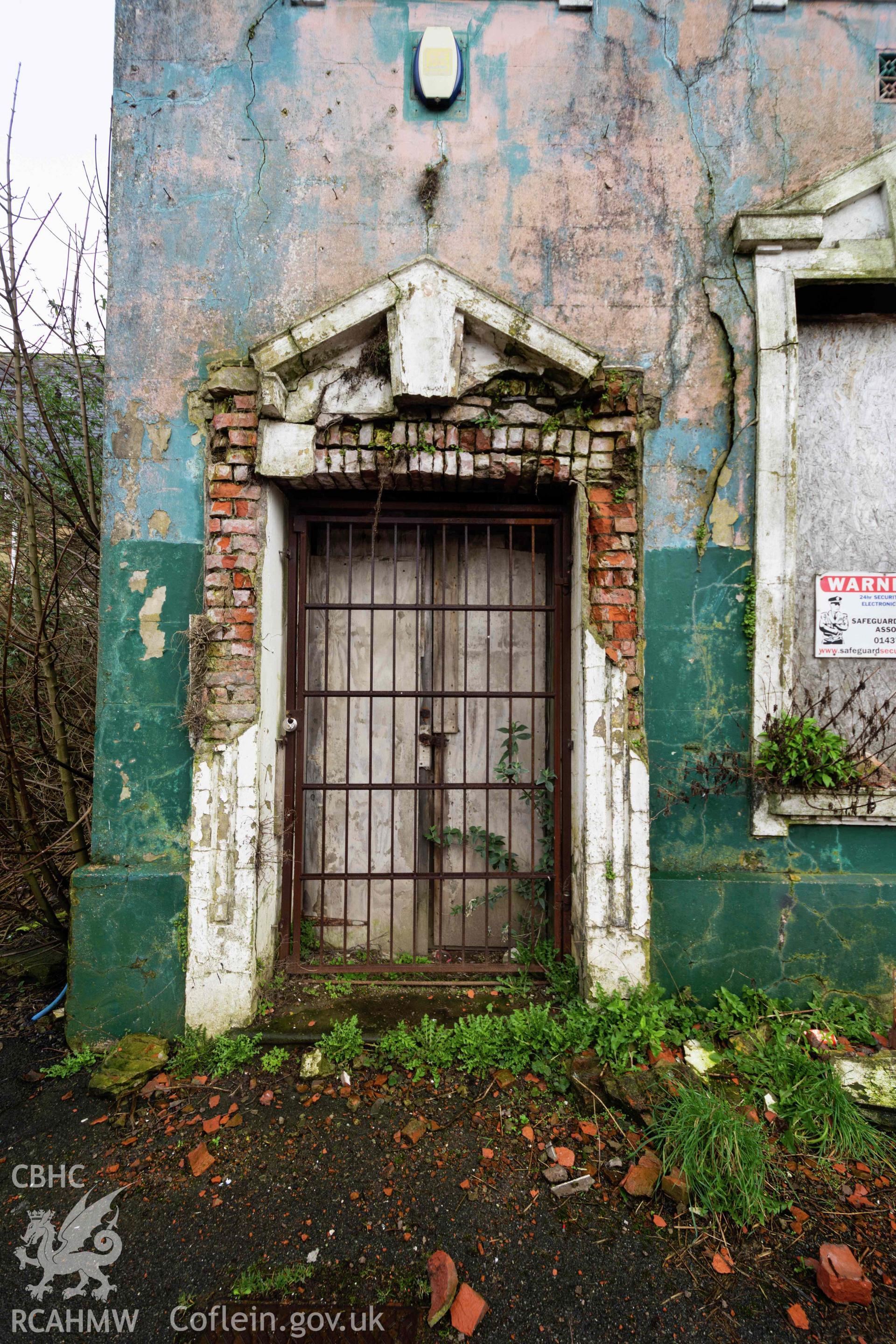 Doorway in poor condition on north end of west front façade. Perrots Road Wesleyan Methodist Chapel, Haverfordwest. Part of a photographic survey conducted by Meilyr Powel on 20 February 2023.