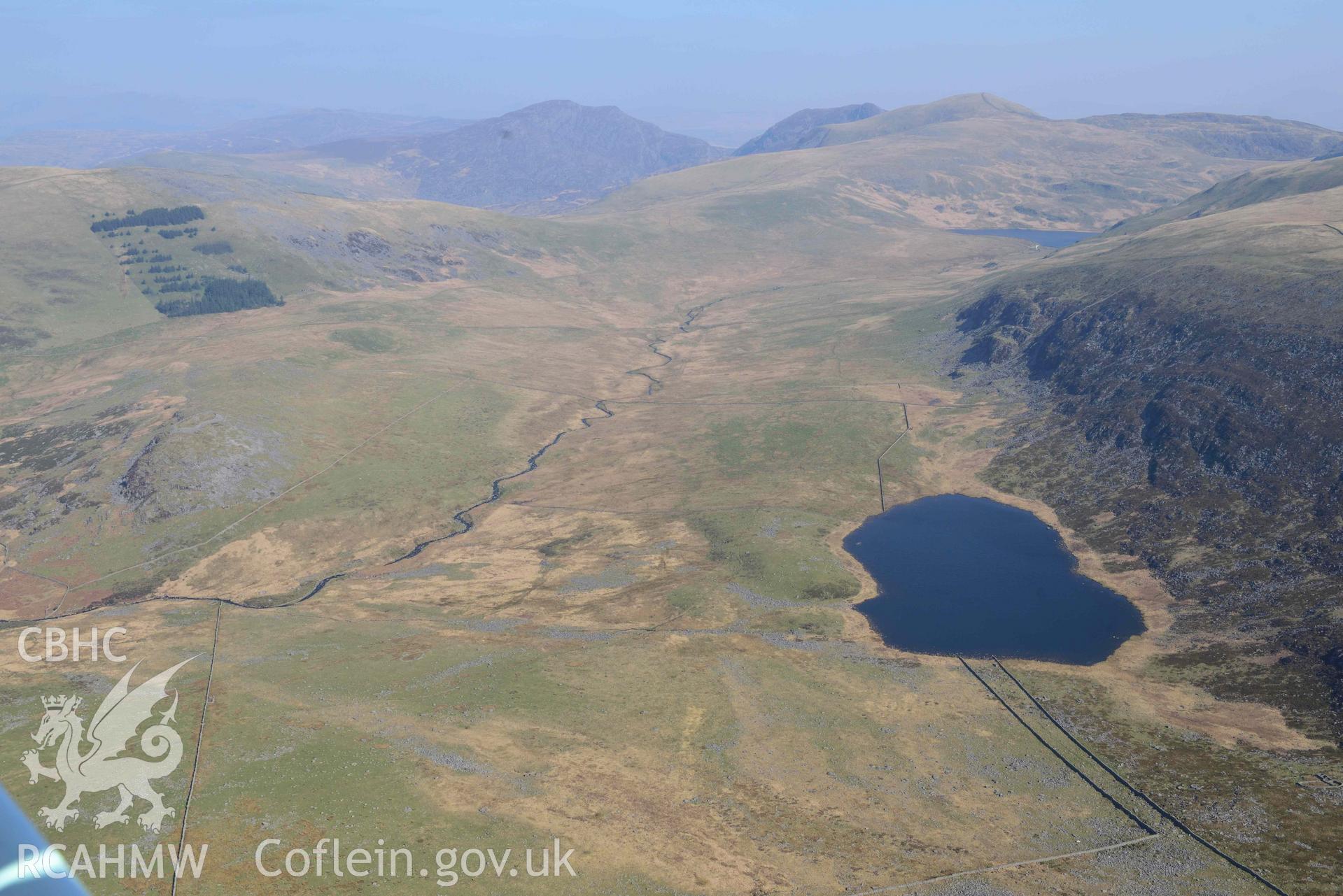 Craig y Dinas Hillfort, wide landscape view with Llyn Irddyn. Oblique aerial photographs taken during the Royal Commission’s programme of archaeological aerial reconnaissance by Toby Driver on 25 March 2022.