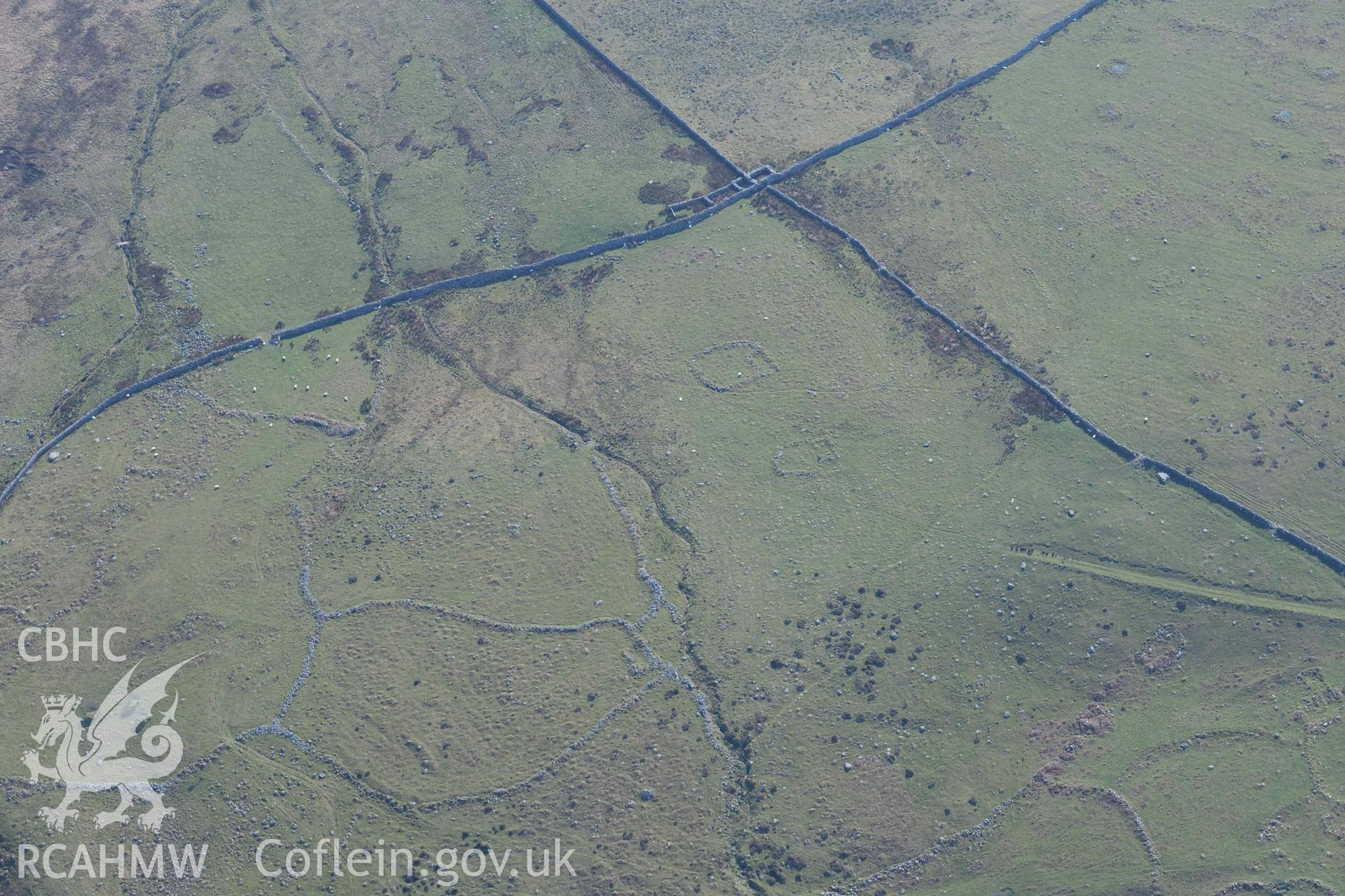 Settlement and fields above Egryn Abbey. Oblique aerial photograph taken during the Royal Commission’s programme of archaeological aerial reconnaissance by Toby Driver on 25 March 2022.