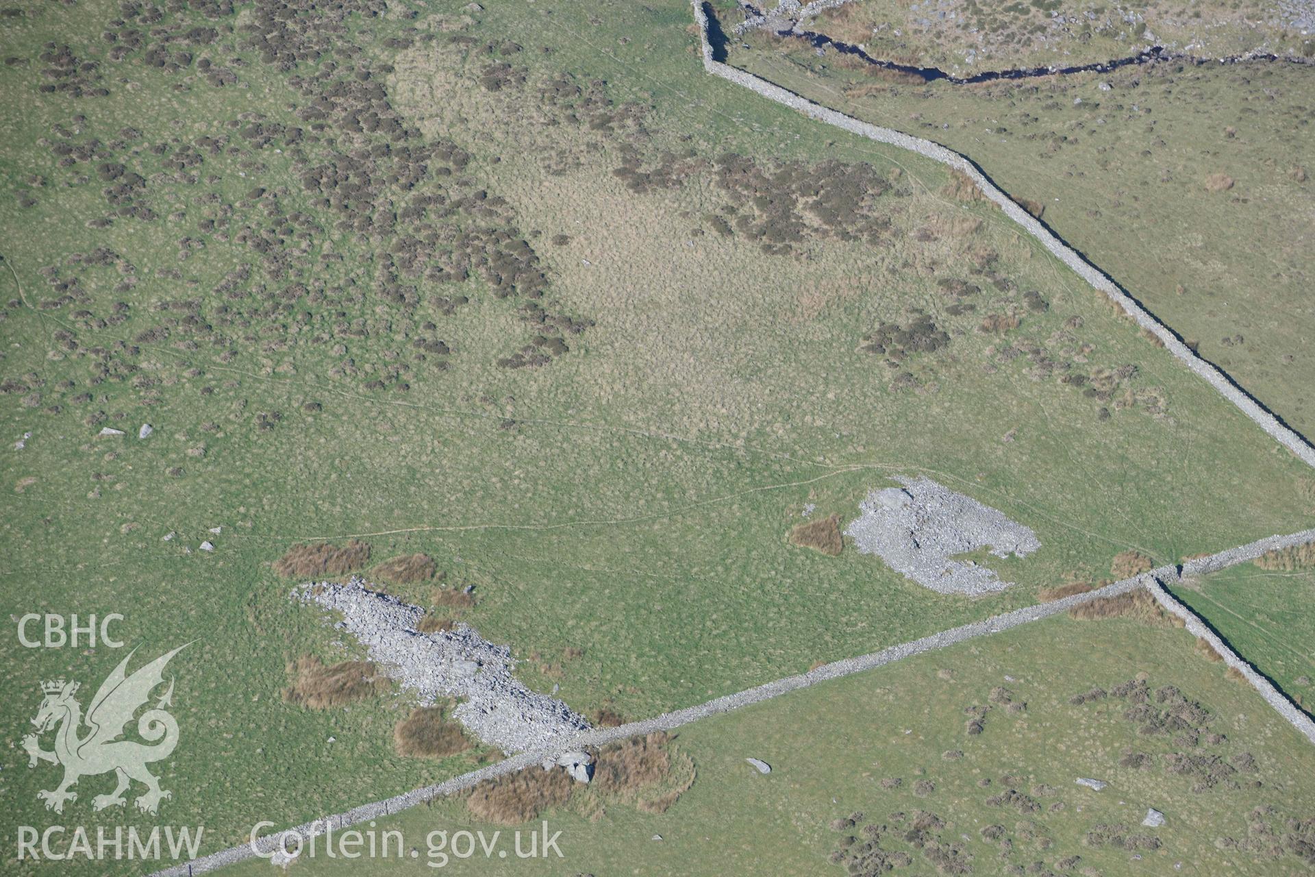 Carneddau Hengwm, chambered long cairns. Oblique aerial photograph taken during the Royal Commission’s programme of archaeological aerial reconnaissance by Toby Driver on 25 March 2022.