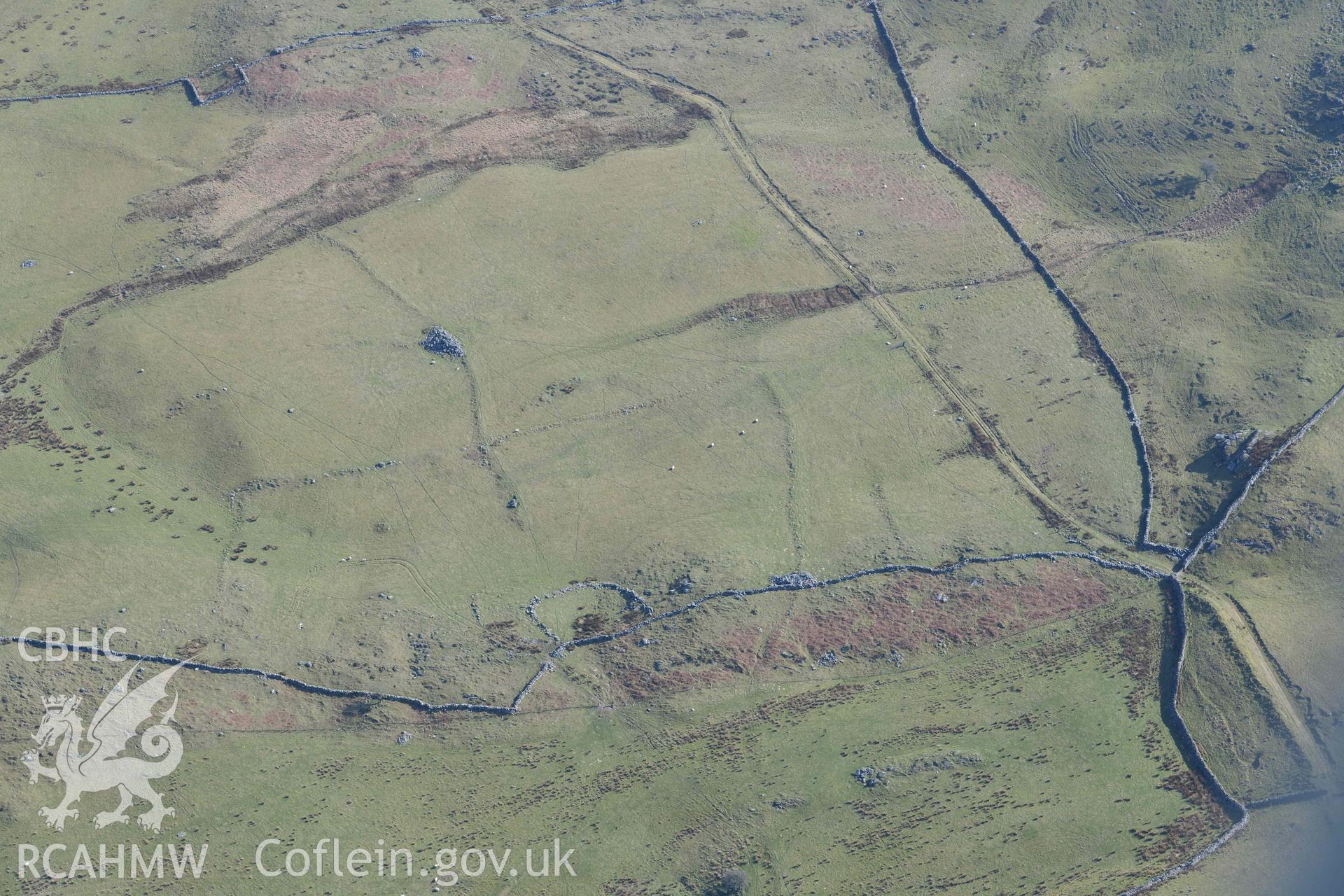 Ffridd Fedw ancient fields and kerb cairn. Oblique aerial photographs taken during the Royal Commission’s programme of archaeological aerial reconnaissance by Toby Driver on 25 March 2022.