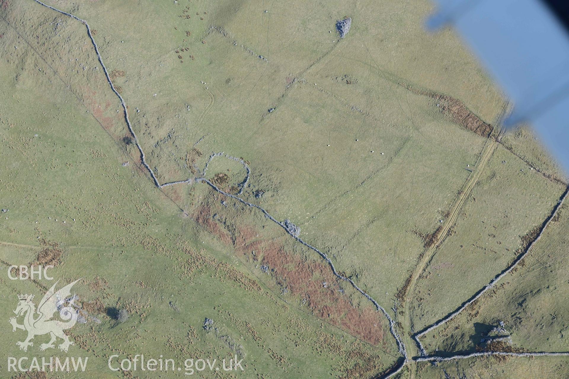 Ffridd Fedw ancient fields and kerb cairn. Oblique aerial photographs taken during the Royal Commission’s programme of archaeological aerial reconnaissance by Toby Driver on 25 March 2022.