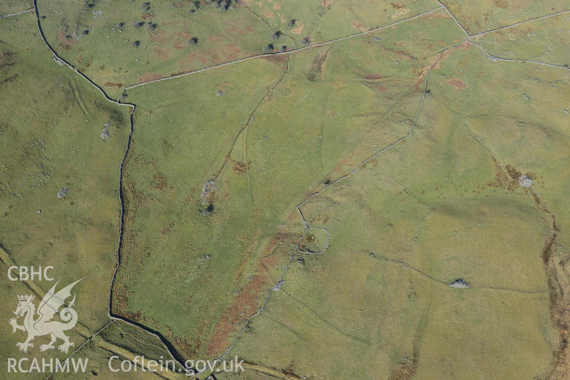 Ffridd Fedw ancient fields and kerb cairn. Oblique aerial photographs taken during the Royal Commission’s programme of archaeological aerial reconnaissance by Toby Driver on 25 March 2022.