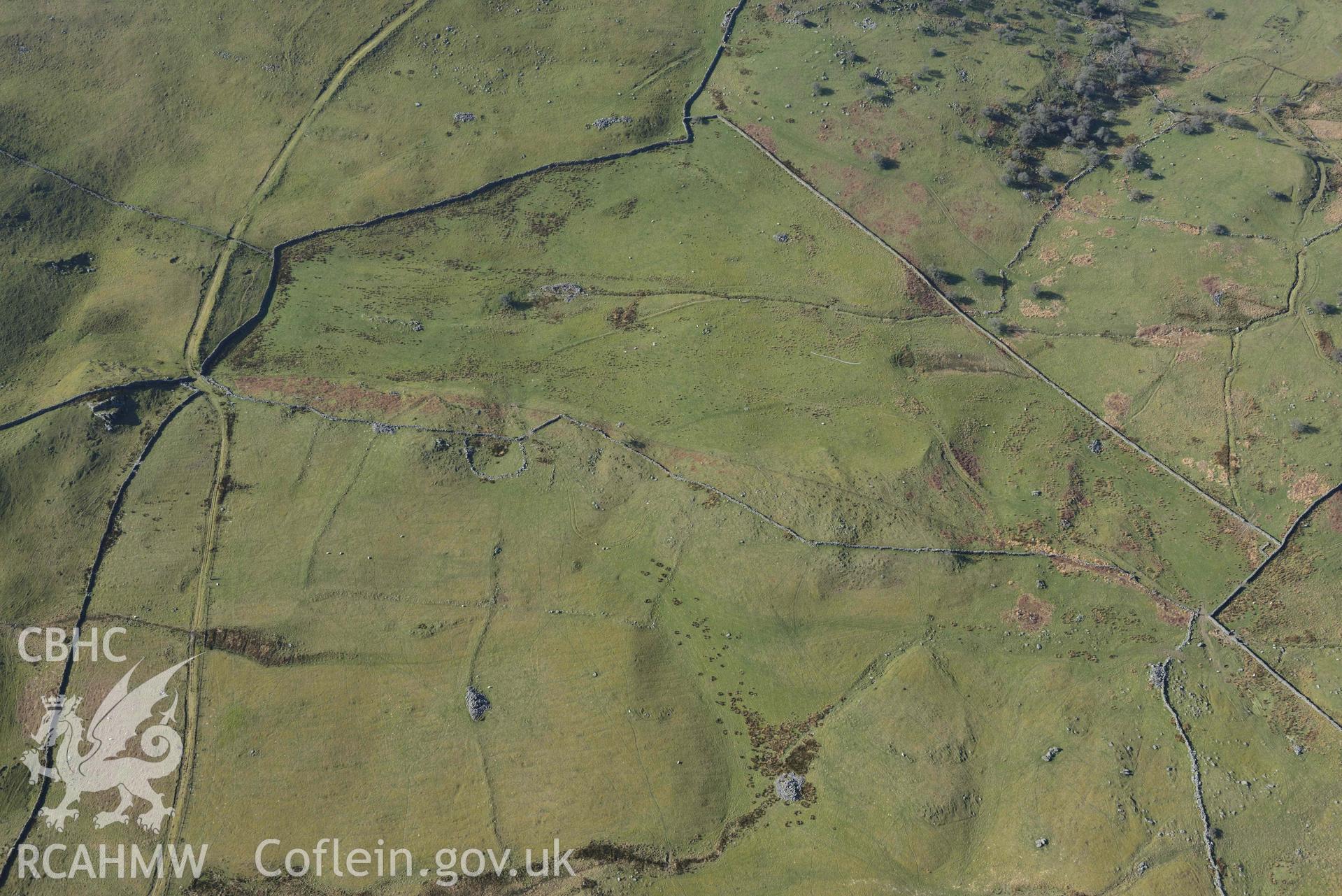 Ffridd Fedw ancient fields and kerb cairn. Oblique aerial photographs taken during the Royal Commission’s programme of archaeological aerial reconnaissance by Toby Driver on 25 March 2022.