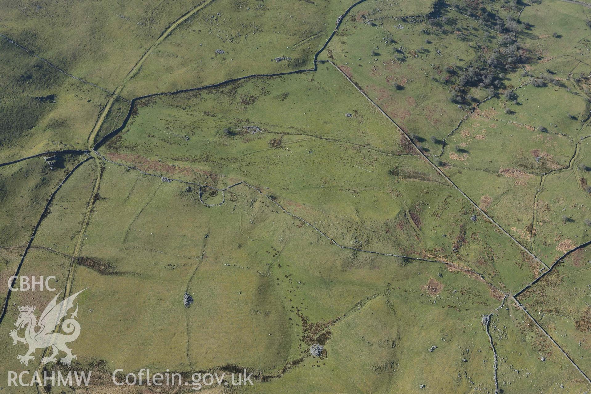 Ffridd Fedw ancient fields and kerb cairn. Oblique aerial photographs taken during the Royal Commission’s programme of archaeological aerial reconnaissance by Toby Driver on 25 March 2022.