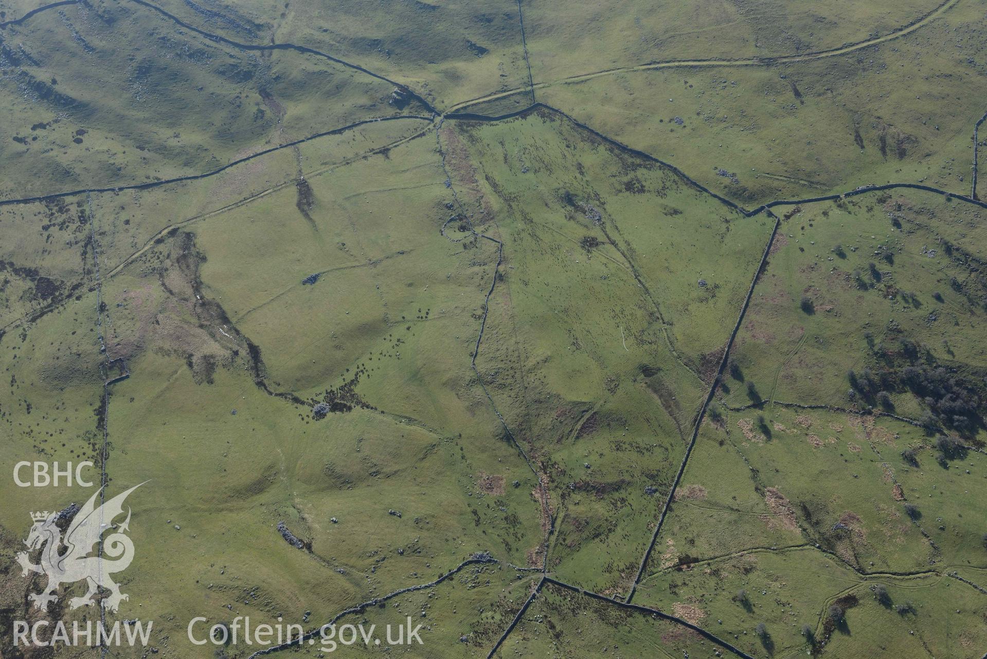 Ffridd Fedw ancient fields and kerb cairn. Oblique aerial photographs taken during the Royal Commission’s programme of archaeological aerial reconnaissance by Toby Driver on 25 March 2022.