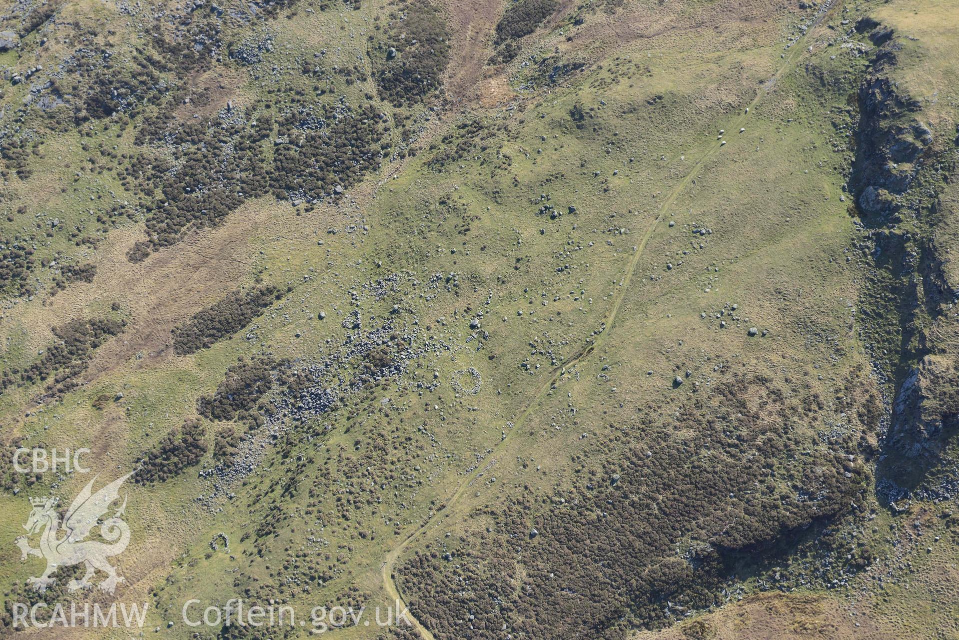 Hut circles east of Moel Geifr. Oblique aerial photographs taken during the Royal Commission’s programme of archaeological aerial reconnaissance by Toby Driver on 25 March 2022.