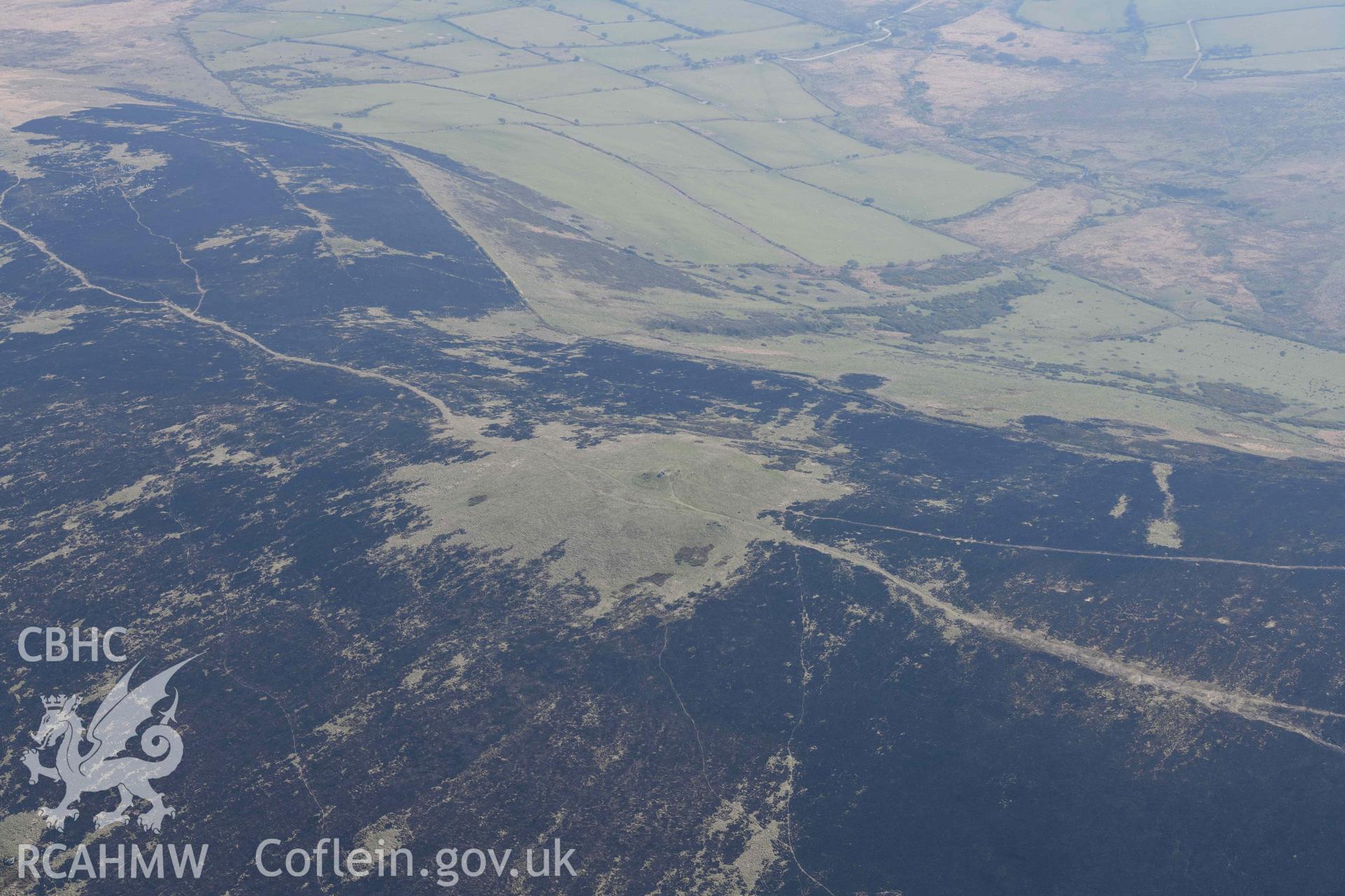 Mynydd Preseli, bracken burn centred on Foel Feddau cairn. Oblique aerial photograph taken during the Royal Commission’s programme of archaeological aerial reconnaissance by Toby Driver on 25 March 2022.