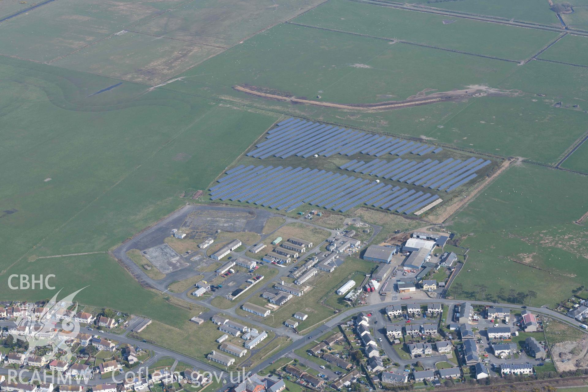 Morfa RAF base, Tywyn, with solar farm. Oblique aerial photograph taken during the Royal Commission’s programme of archaeological aerial reconnaissance by Toby Driver on 25 March 2022.