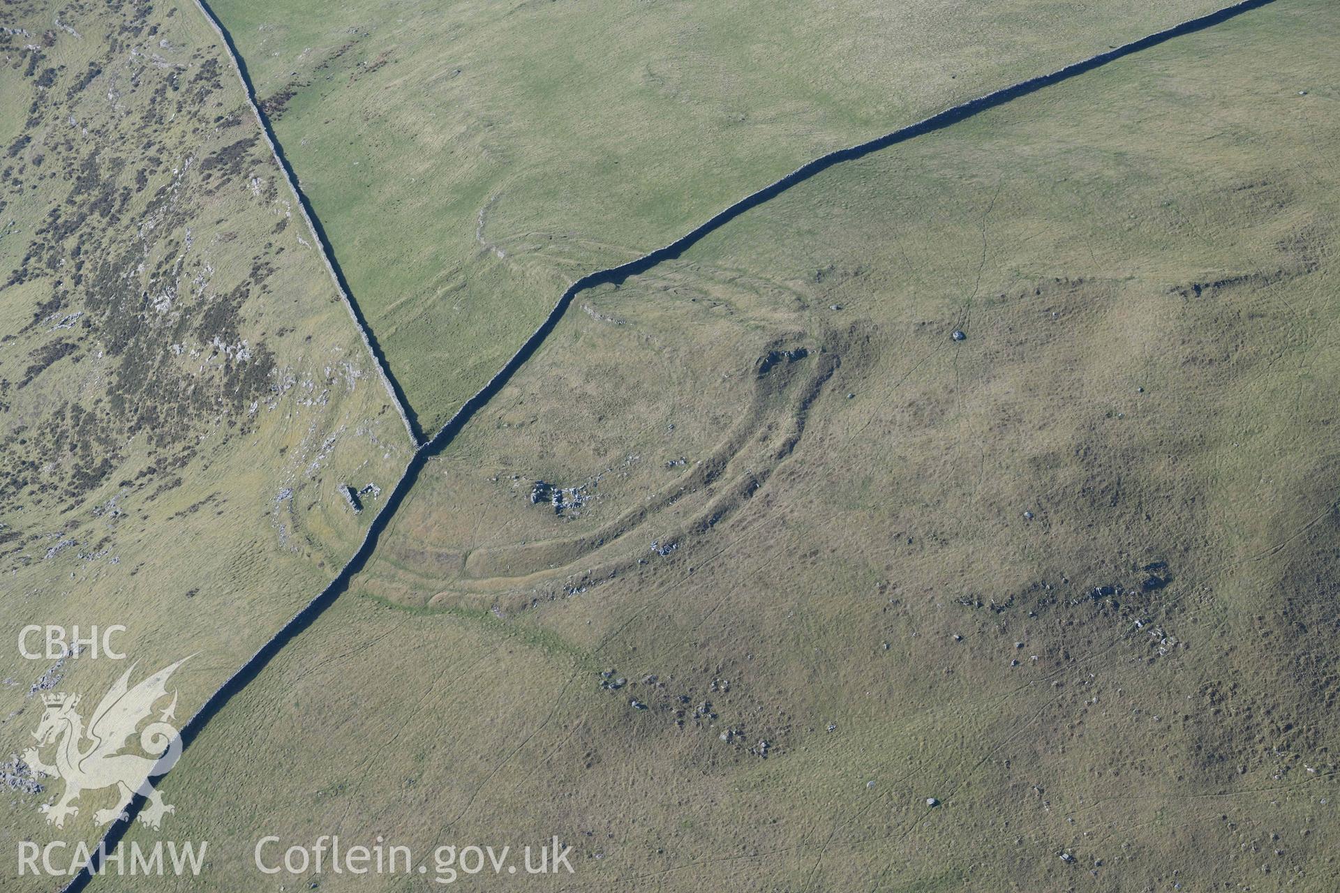 Moel Goedog hillfort. Oblique aerial photograph taken during the Royal Commission’s programme of archaeological aerial reconnaissance by Toby Driver on 25 March 2022.