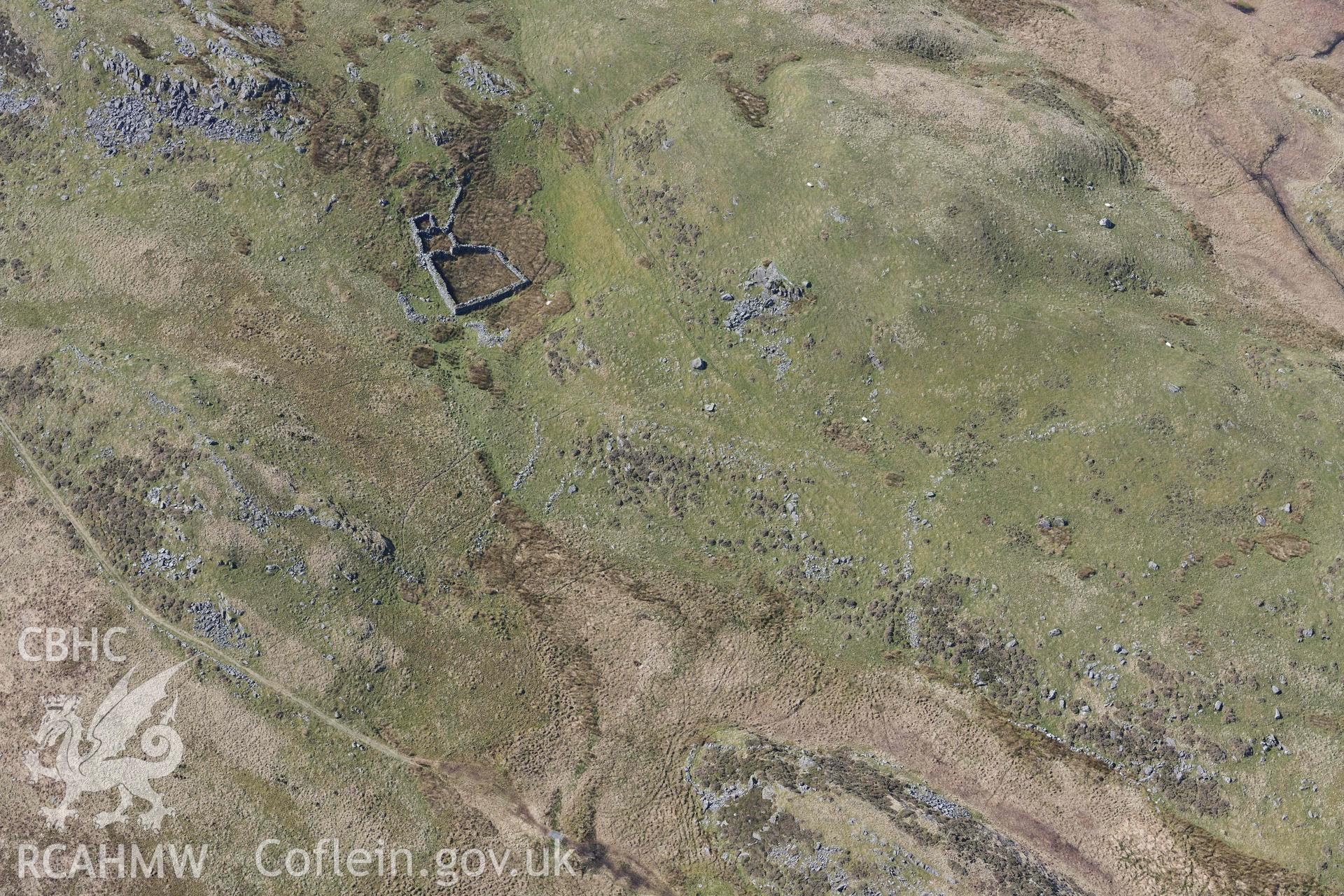 Settlements south of Bryn Cader Faner. Oblique aerial photograph taken during the Royal Commission’s programme of archaeological aerial reconnaissance by Toby Driver on 25 March 2022.