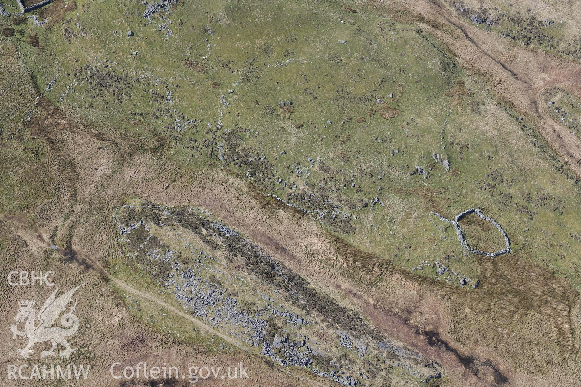 Settlements south of Bryn Cader Faner. Oblique aerial photograph taken during the Royal Commission’s programme of archaeological aerial reconnaissance by Toby Driver on 25 March 2022.