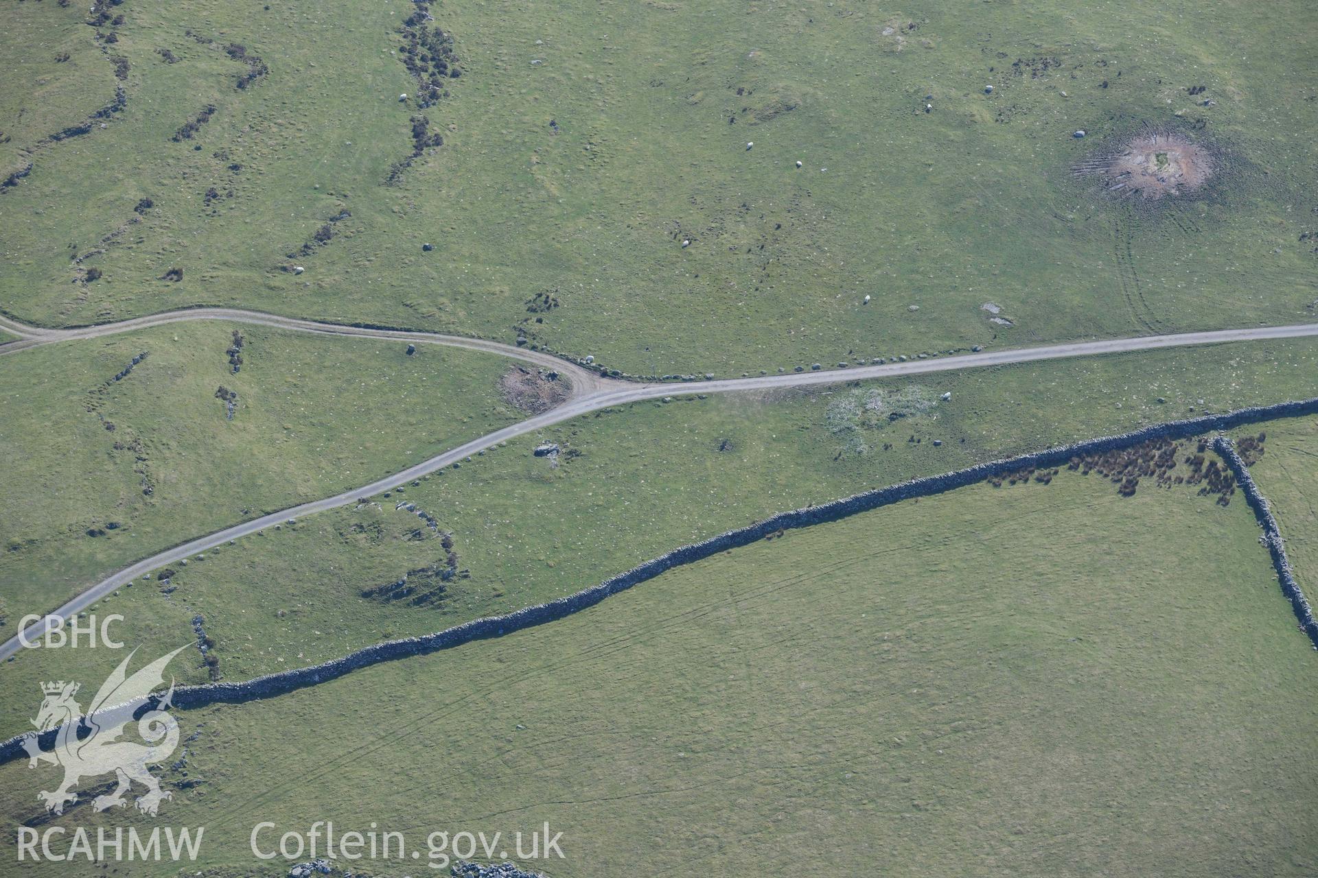 Fonlief Hir standing stone. Oblique aerial photograph taken during the Royal Commission’s programme of archaeological aerial reconnaissance by Toby Driver on 25 March 2022.