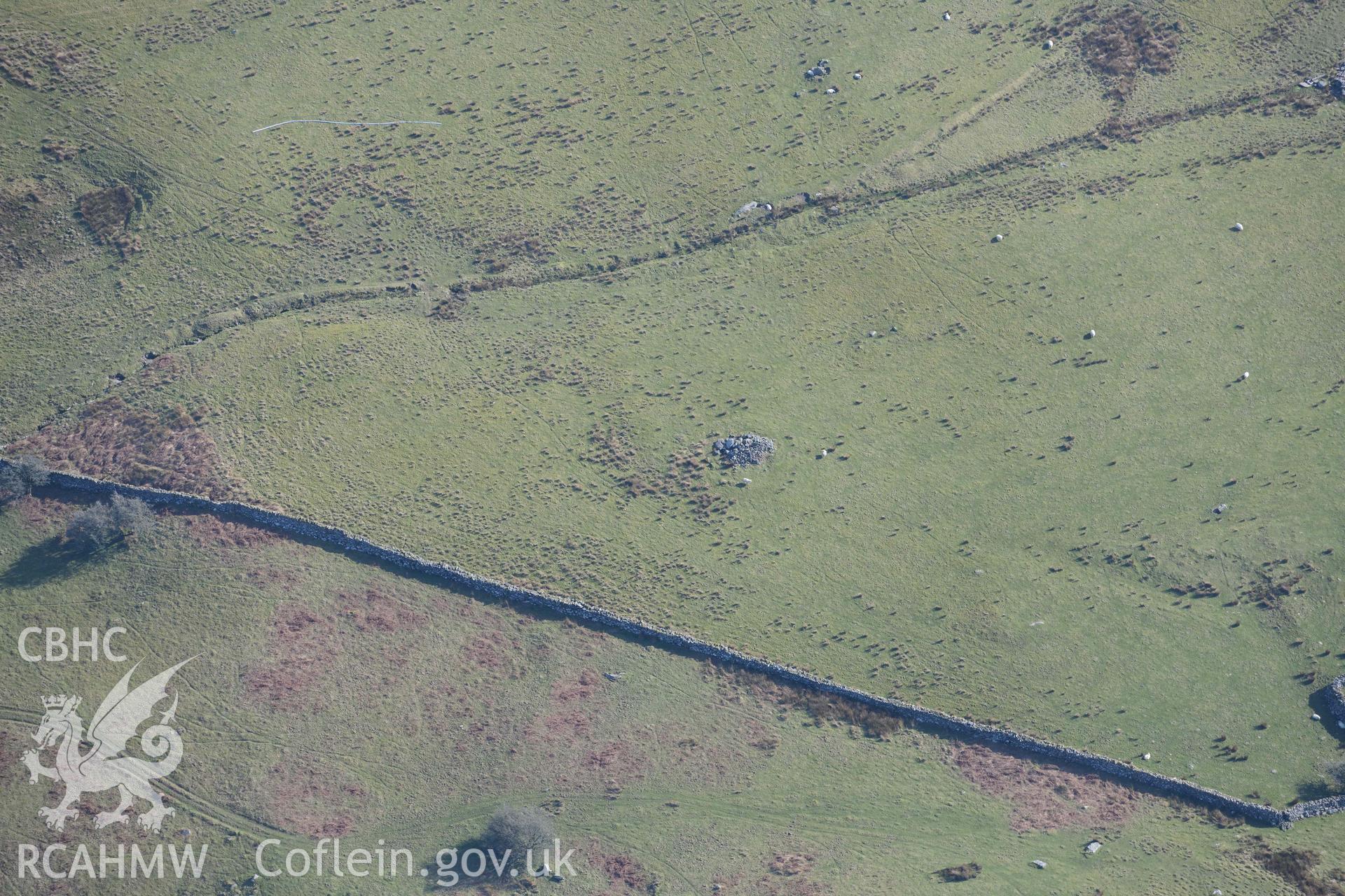 Tyddyn Sion Wyn ring cairn. Oblique aerial photograph taken during the Royal Commission’s programme of archaeological aerial reconnaissance by Toby Driver on 25 March 2022.