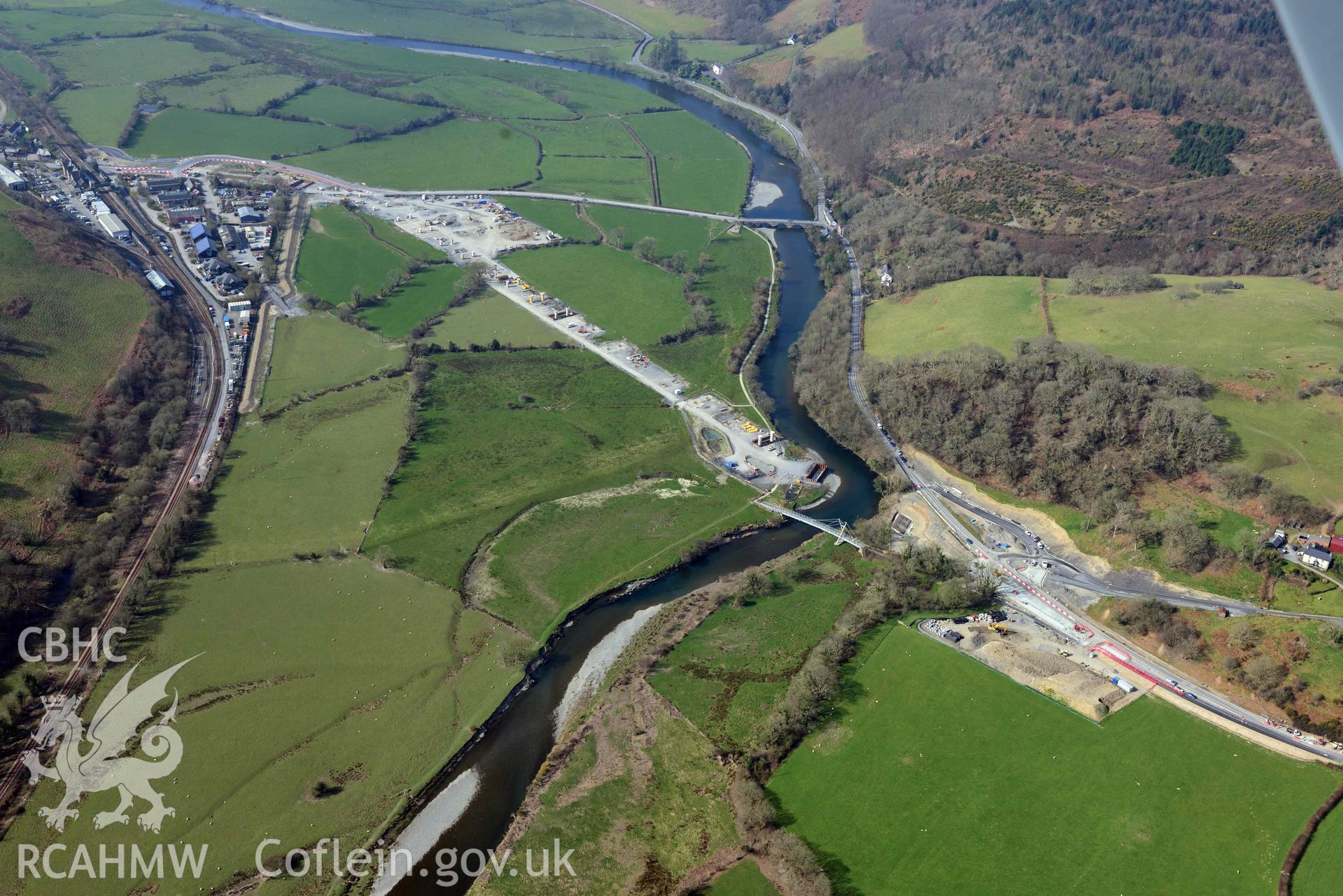 A487 New Dyfi Bridge under construction, and Fridd Round Barrows. Oblique aerial photograph taken during the Royal Commission’s programme of archaeological aerial reconnaissance by Toby Driver on 25 March 2022.