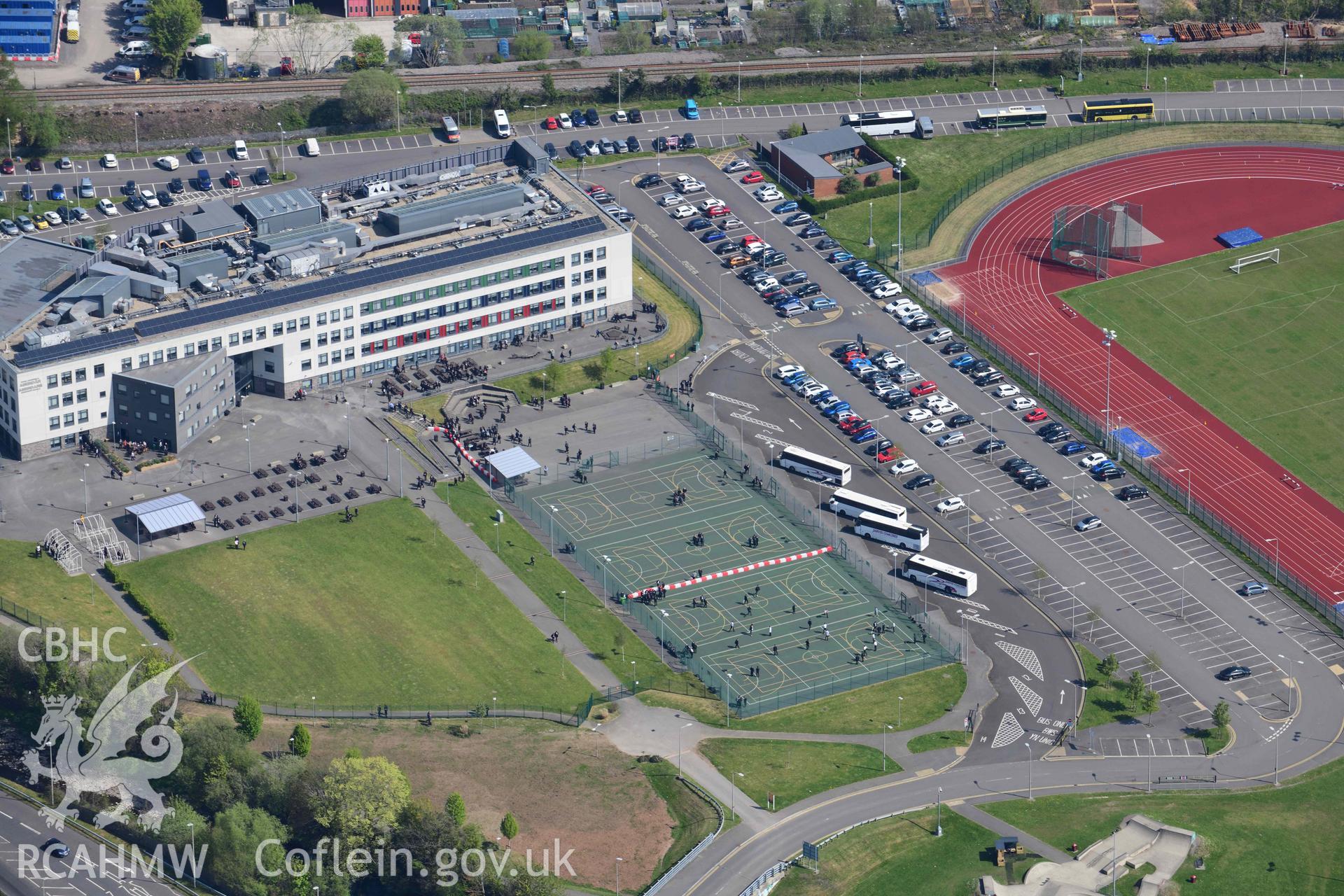 Ynys Stadium, Aberdare, with school. Oblique aerial photograph taken during the Royal Commission's programme of archaeological aerial reconnaissance by Toby Driver on 29 April 2022.