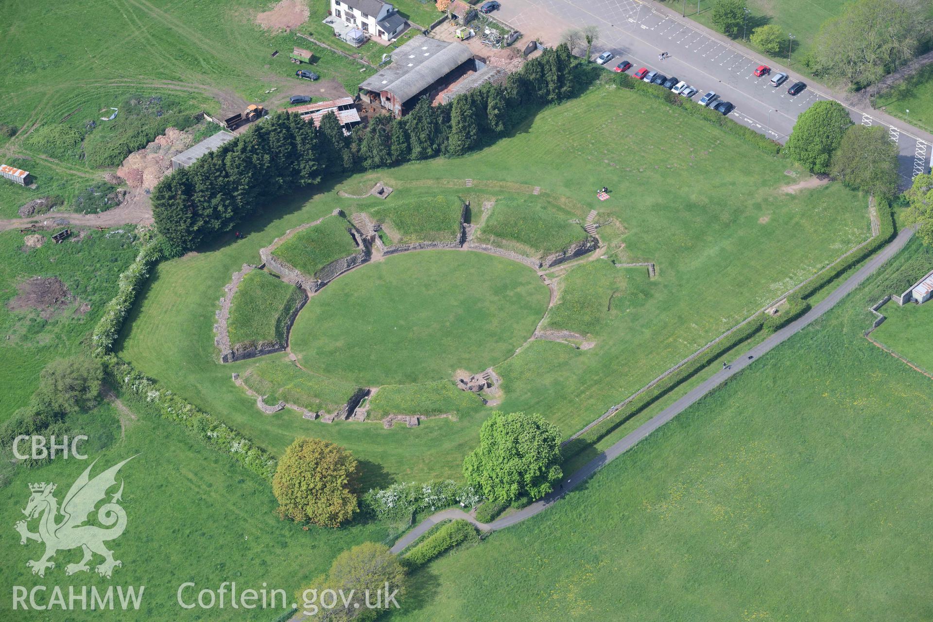 Caerleon Amphitheatre and the south western part of fortress. Oblique aerial photograph taken during the Royal Commission's programme of archaeological aerial reconnaissance by Toby Driver on 29 April 2022.