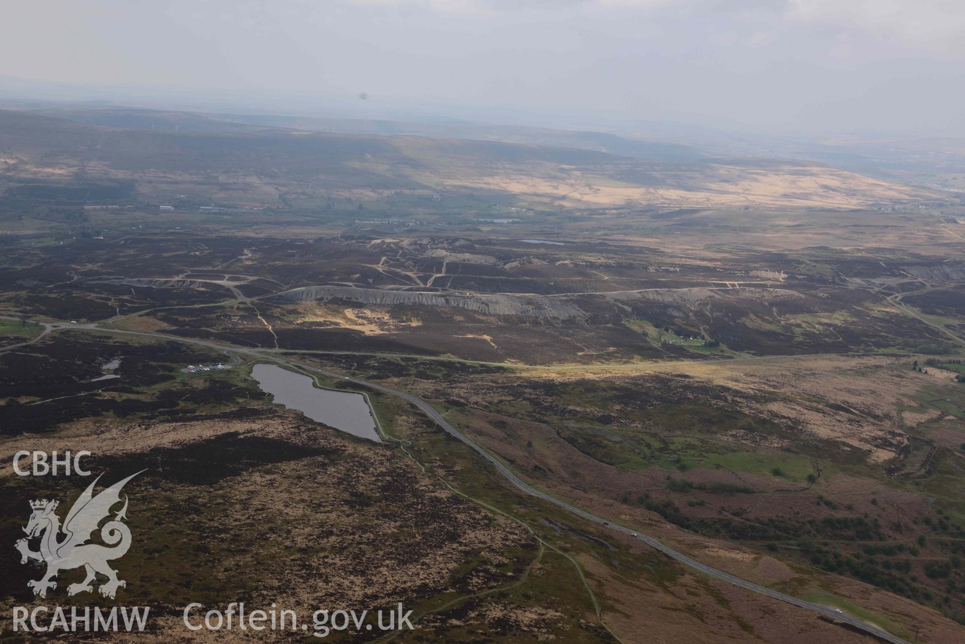 Pen fford goch or Keeper's Pond, in landscape. Oblique aerial photograph taken during the Royal Commission's programme of archaeological aerial reconnaissance by Toby Driver on 29 April 2022.