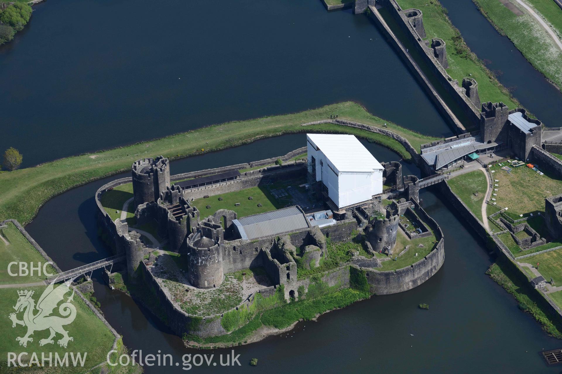 Caerphilly Castle with scaffolded gatehouse. Oblique aerial photograph taken during the Royal Commission's programme of archaeological aerial reconnaissance by Toby Driver on 29 April 2022.