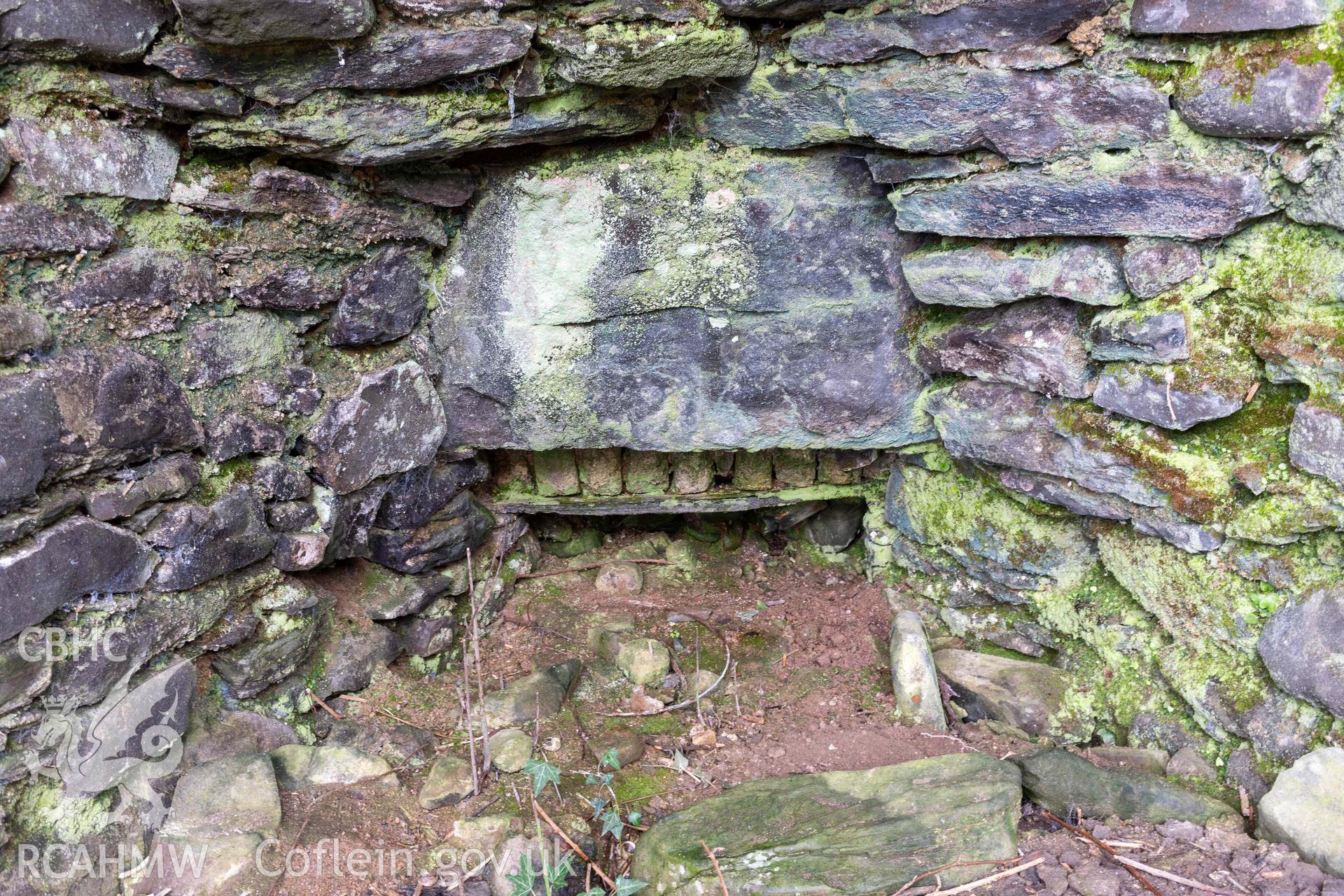 Kiln 3, draw-hole in kiln-eye, west elevation. Part of photographic survey of Aberstrincell lime kilns and coal yard, conducted by Louise Barker of the RCAHMW survey team on 21 March 2024.