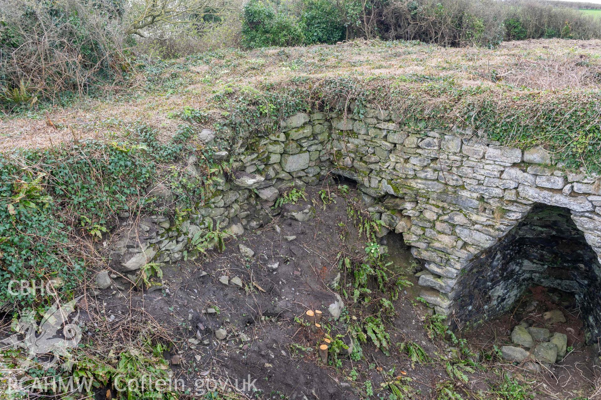 Steps in rear (south) retaining wall between kilns 2 and 3. Part of photographic survey of Aberstrincell lime kilns and coal yard, conducted by Louise Barker of the RCAHMW survey team on 21 March 2024.