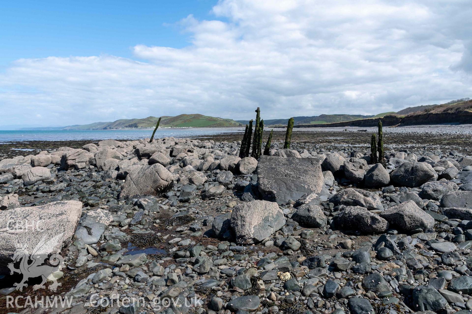 Northeast arm of breakwater from the north. Part of photographic survey of Aberstrincell lime kilns and coal yard, conducted by Louise Barker of the RCAHMW survey team on 21 March 2024.