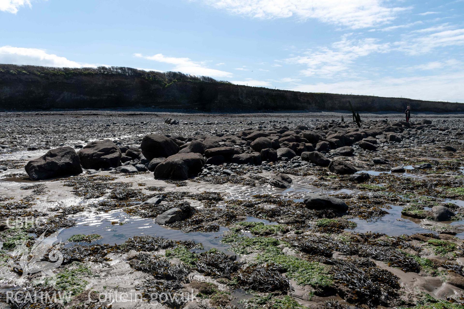 Northeast arm of breakwater at terminus from the north. Part of photographic survey of Aberstrincell lime kilns and coal yard, conducted by Louise Barker of the RCAHMW survey team on 21 March 2024.