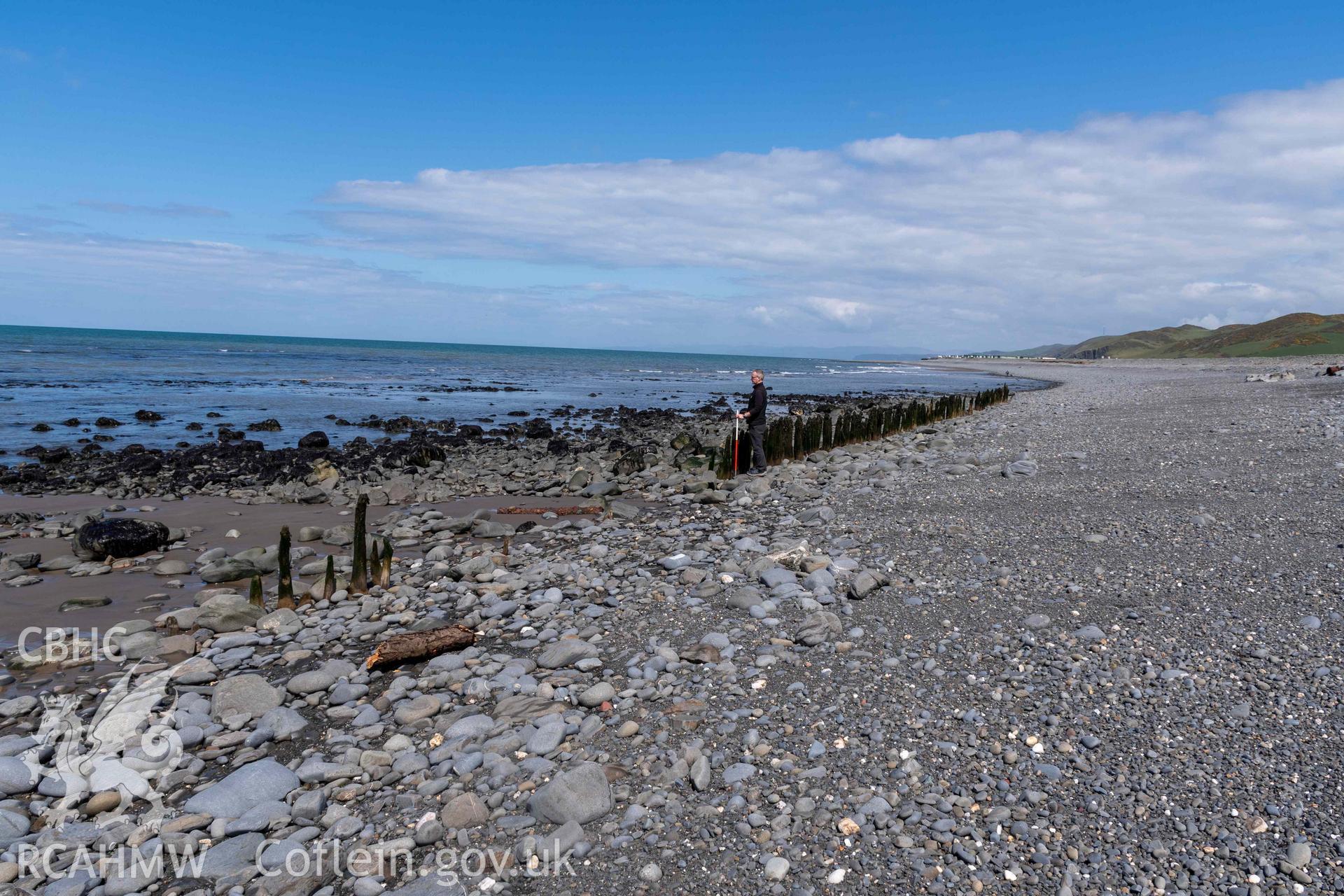 Jetty, Aberstrincell (SN5219768701), looking northeast (with scale). Part of photographic survey of Aberstrincell lime kilns and coal yard, conducted by Louise Barker of the RCAHMW survey team on 21 March 2024.