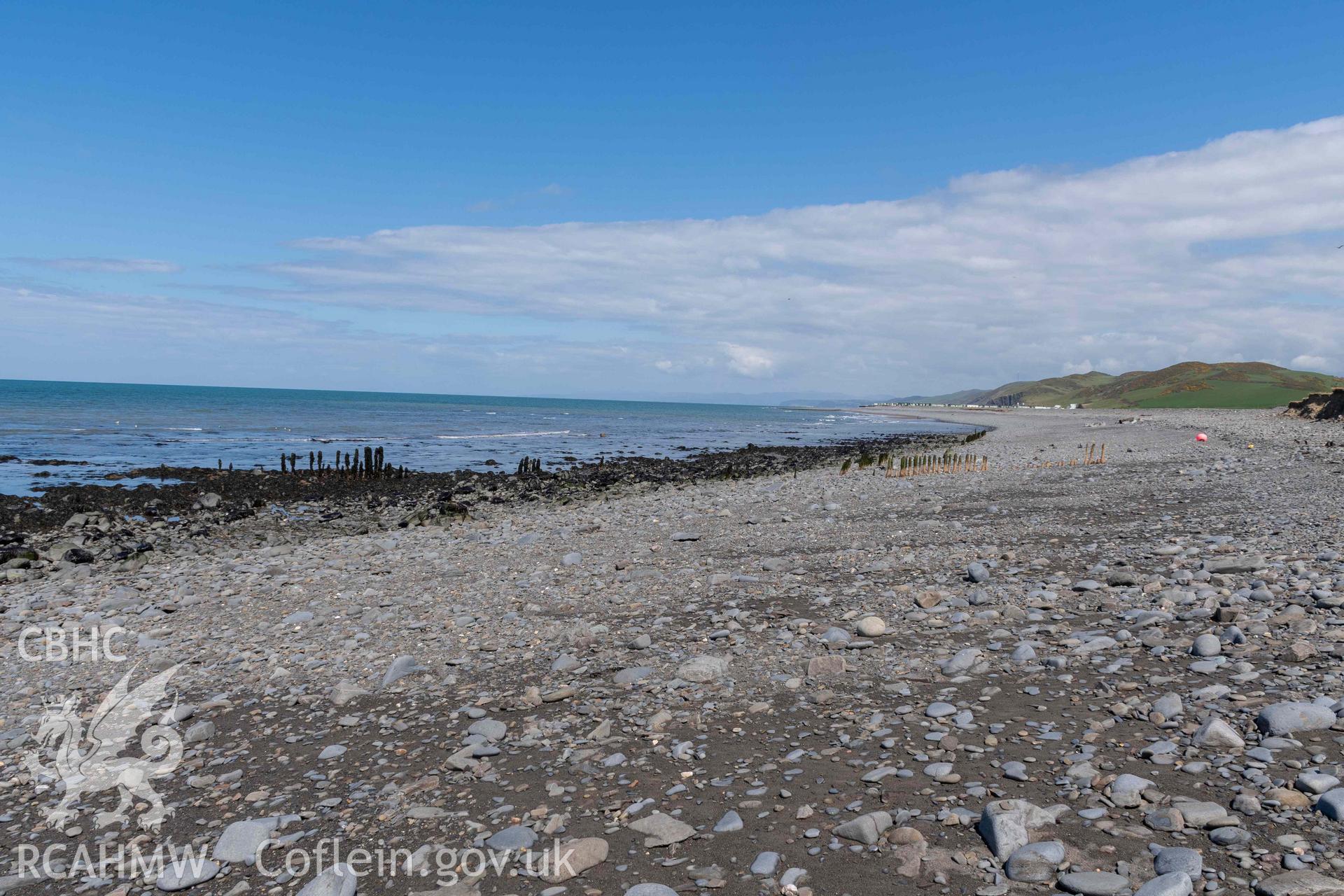 Groyne (SN5213968609) and Jetty (SN5214268626), Aberstrincell, looking northeast. Part of photographic survey of Aberstrincell lime kilns and coal yard, conducted by Louise Barker of the RCAHMW survey team on 21 March 2024.