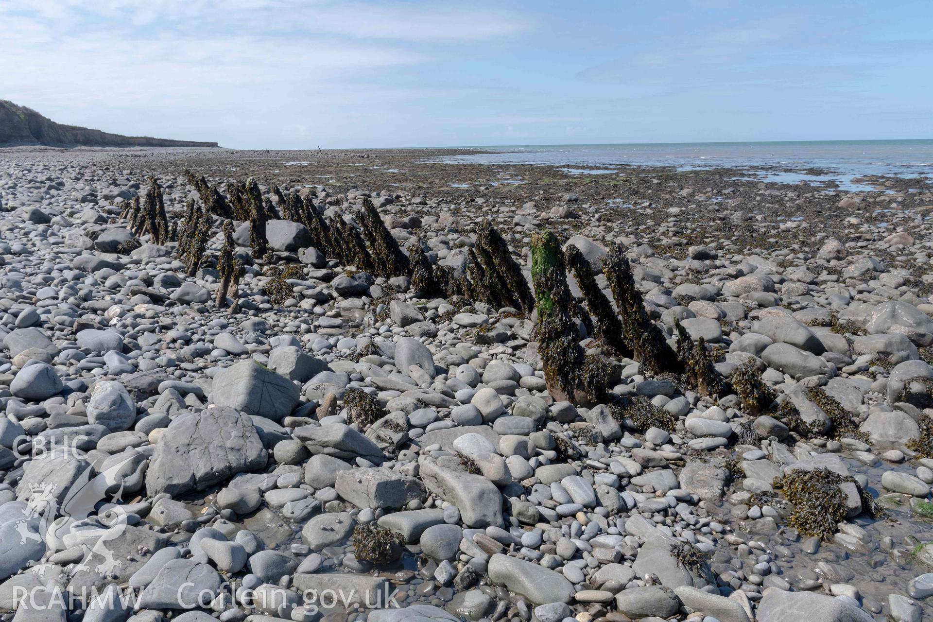 Jetty (SN5190468417), in front of Aberstrincell Lime Kilns, looking southwest. Part of photographic survey of Aberstrincell lime kilns and coal yard, conducted by Louise Barker of the RCAHMW survey team on 21 March 2024.