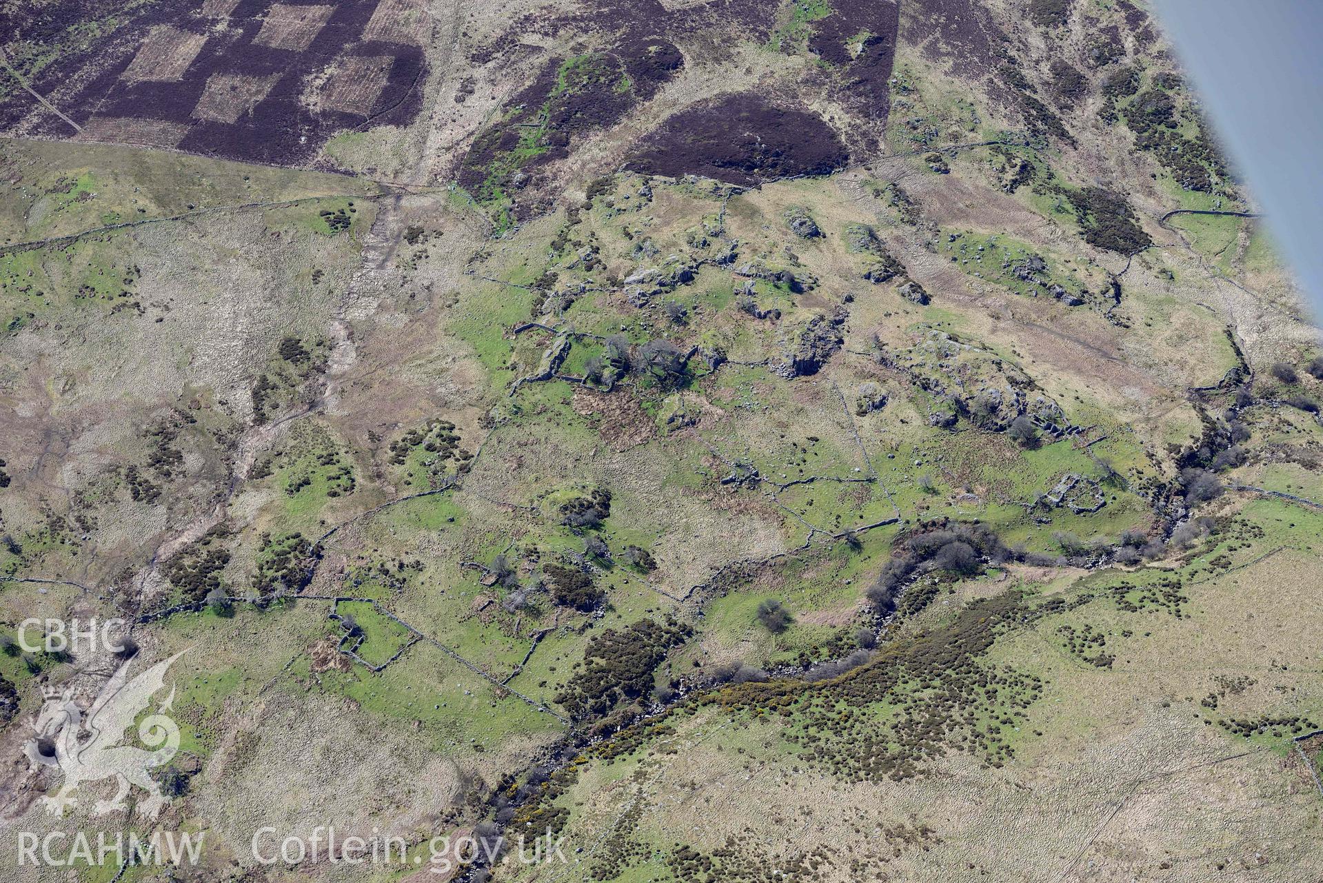 Hafod-y-Garreg, deserted rural settlement, landscape from north. Oblique aerial photograph taken during the Royal Commission’s programme of archaeological aerial reconnaissance by Toby Driver on 20 April 2018.